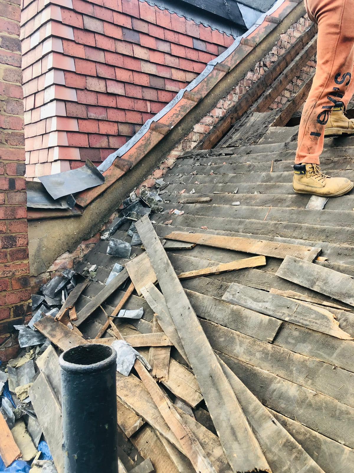 Professional roofers working on a property in London - KS Roof Master