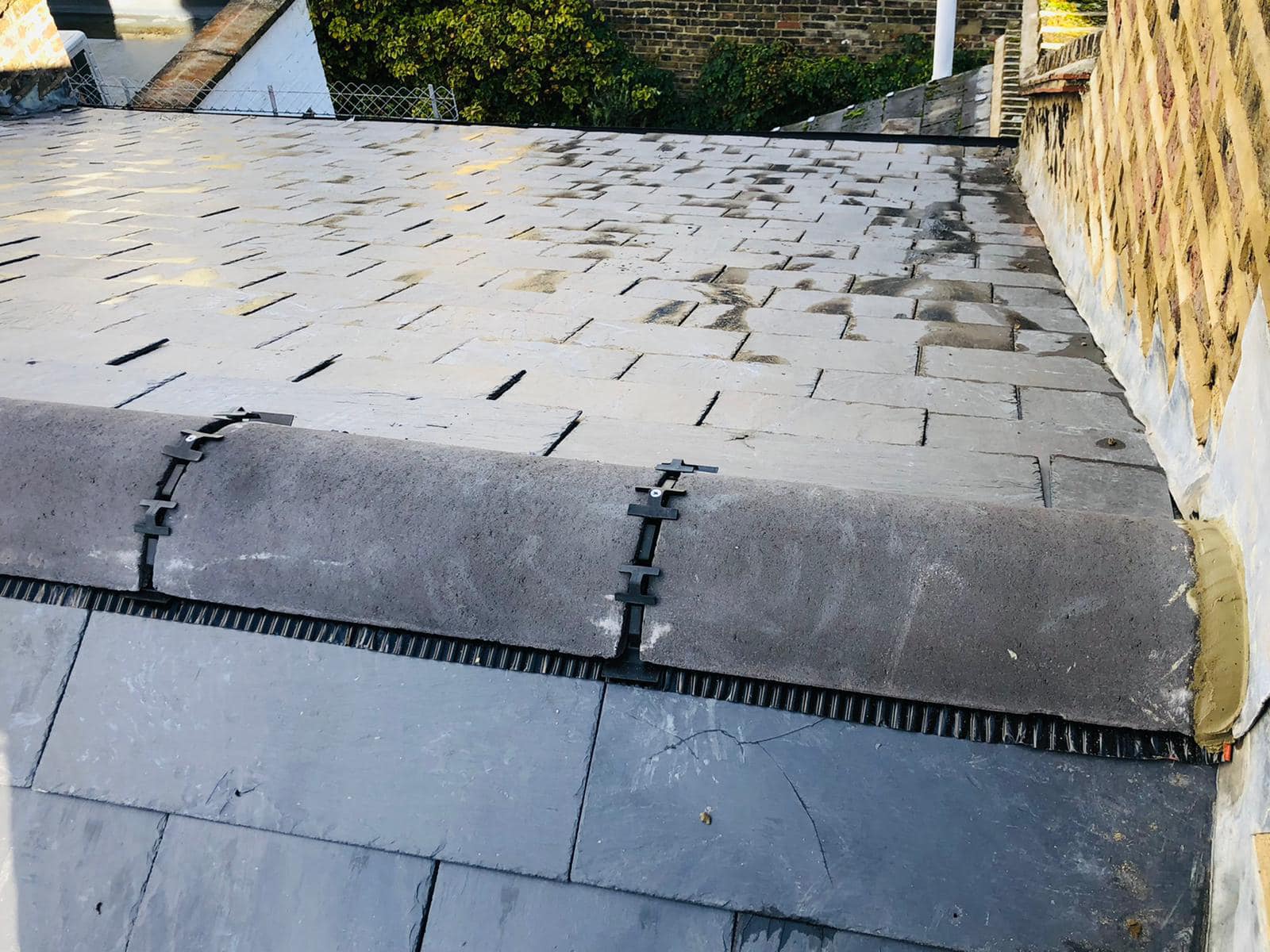 Professional roofers working on a property in London - KS Roof Master