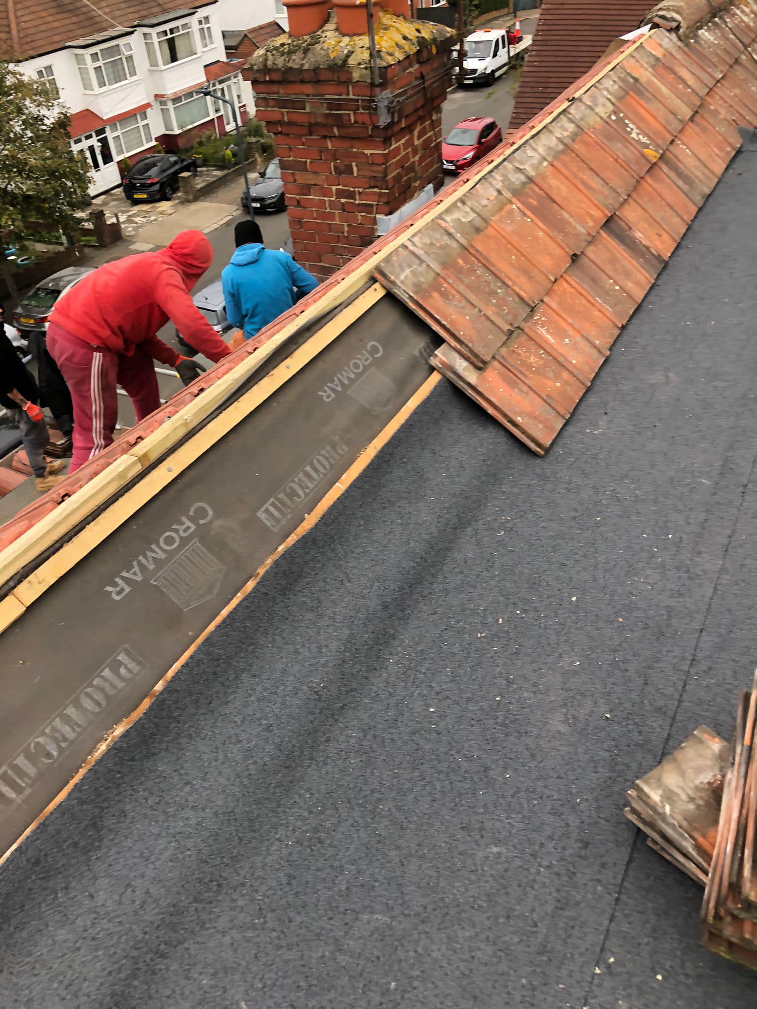 Professional roofers working on a property in London - KS Roof Master