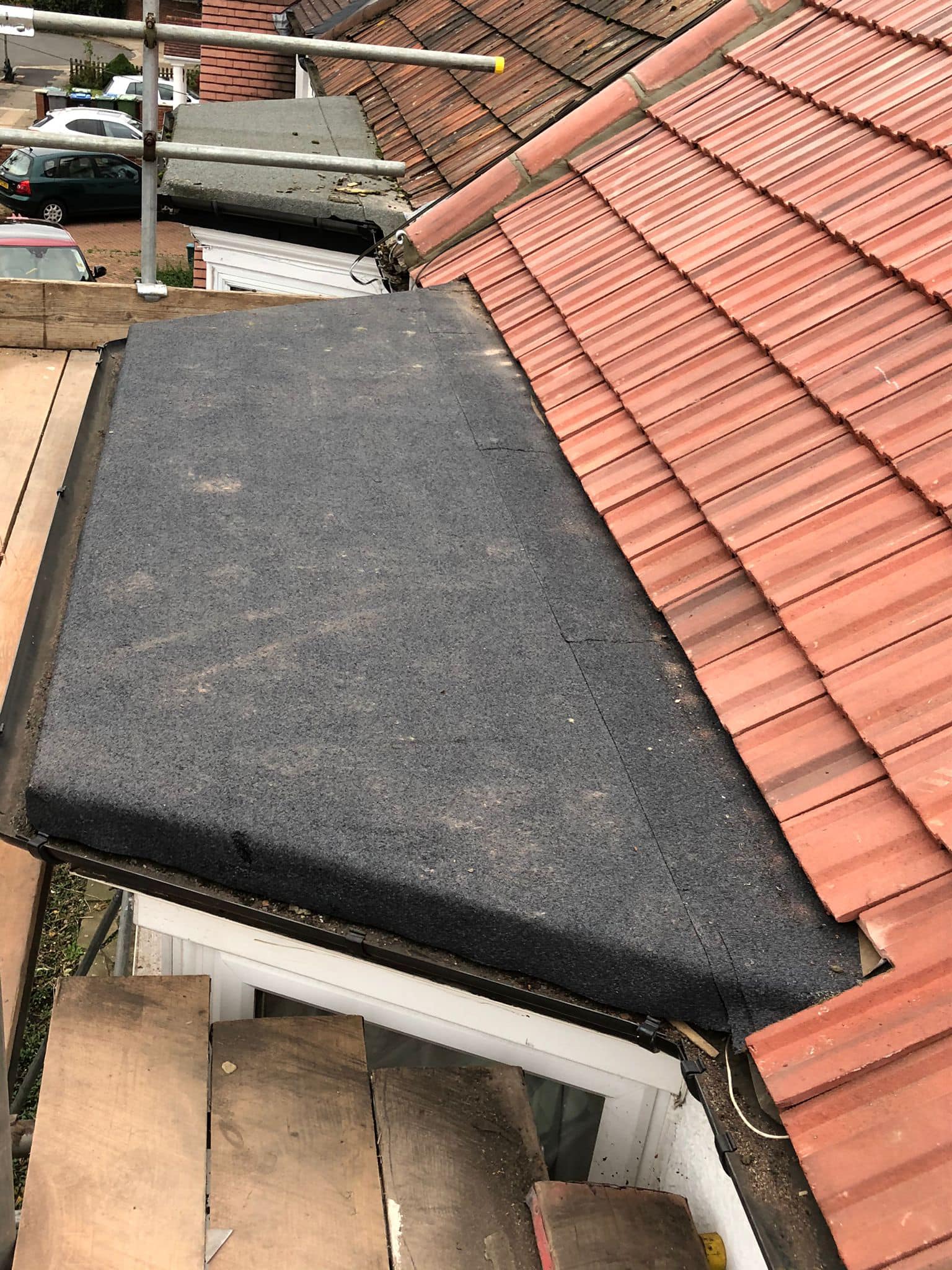 Professional roofers working on a property in London - KS Roof Master