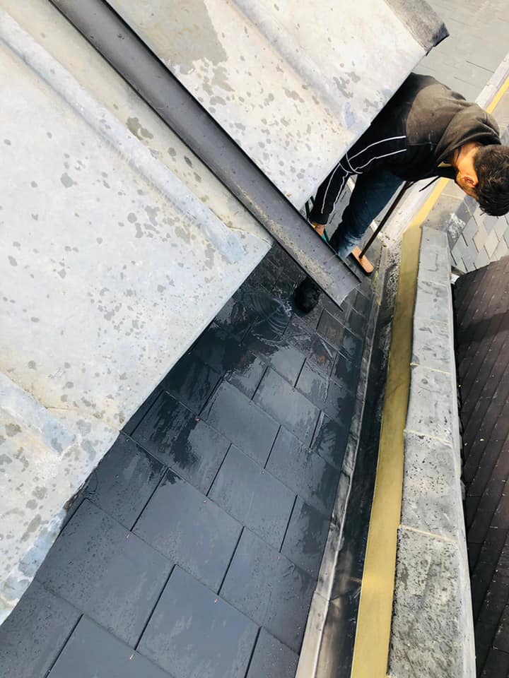 Professional roofers working on a property in London - KS Roof Master