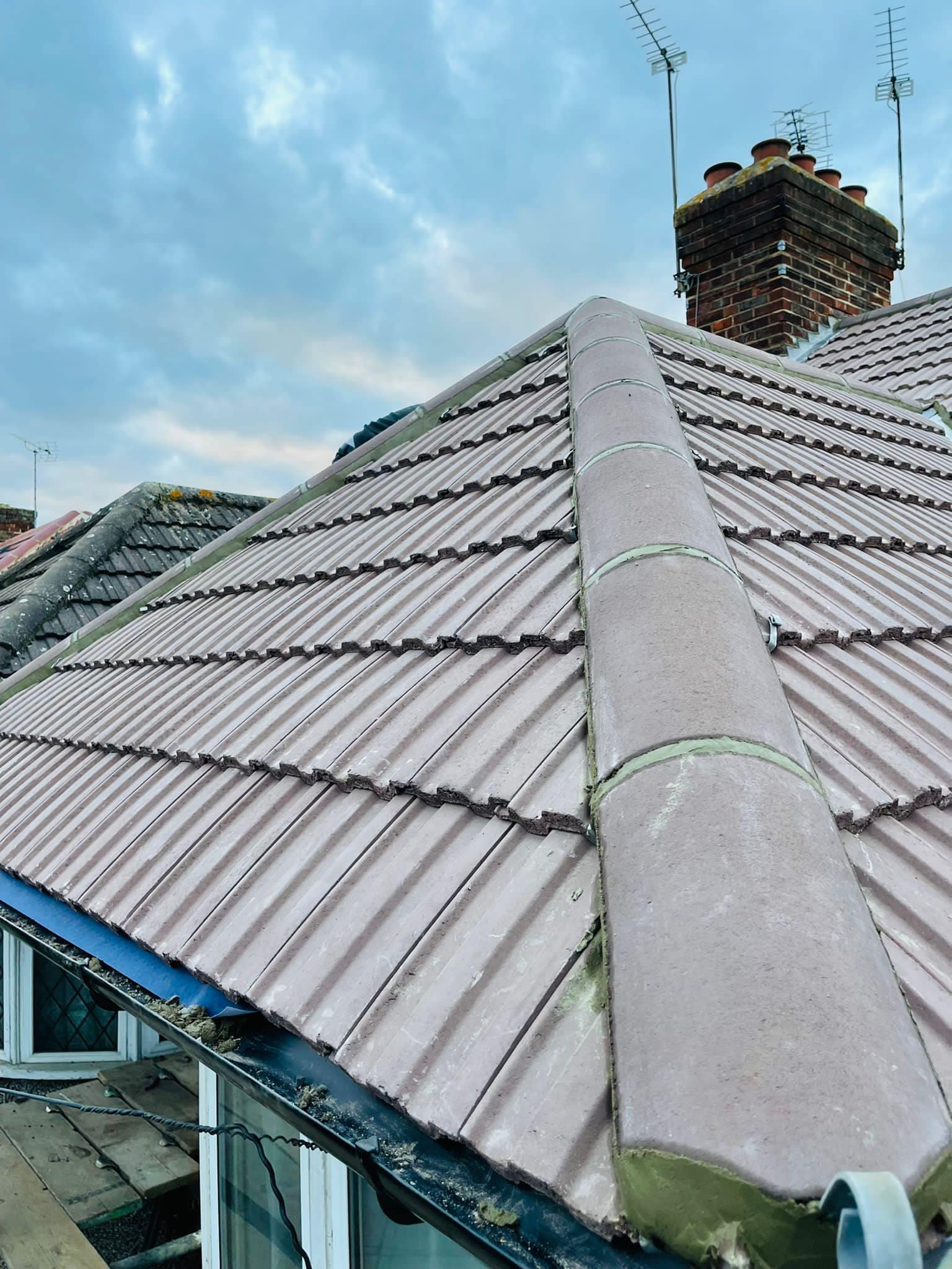 Professional roofers working on a property in London - KS Roof Master