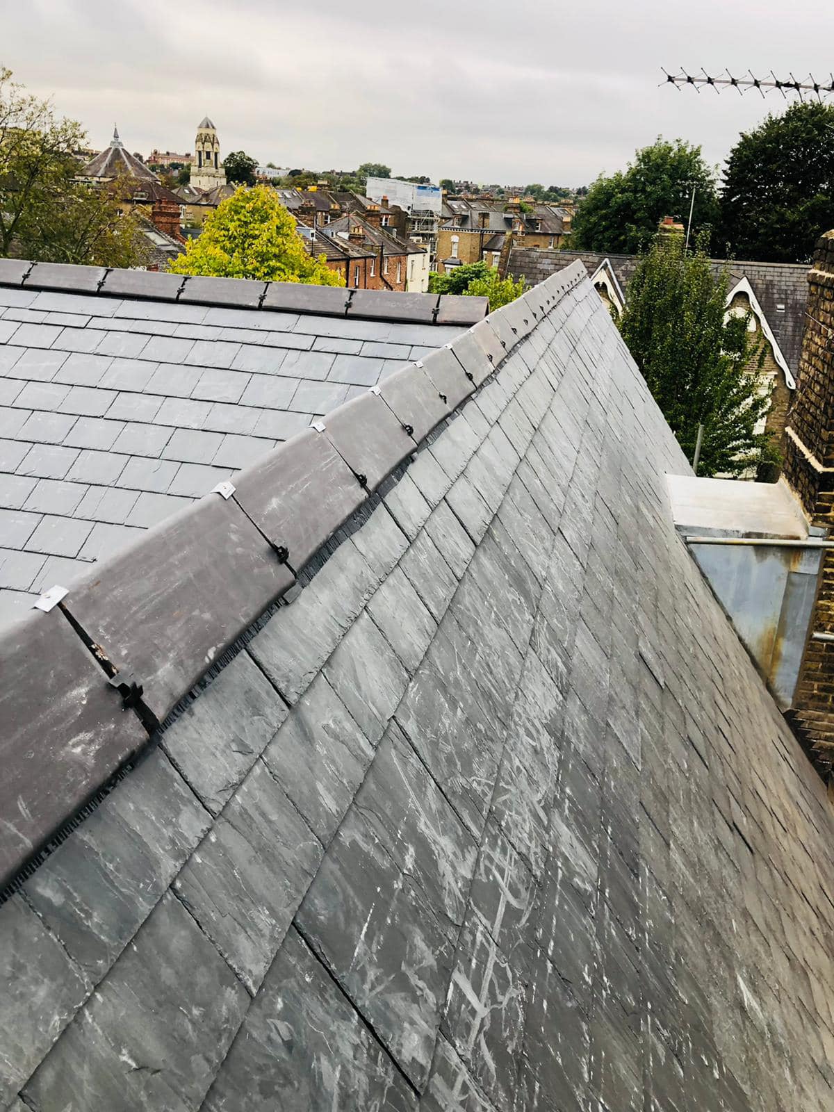 Professional roofers working on a property in London - KS Roof Master
