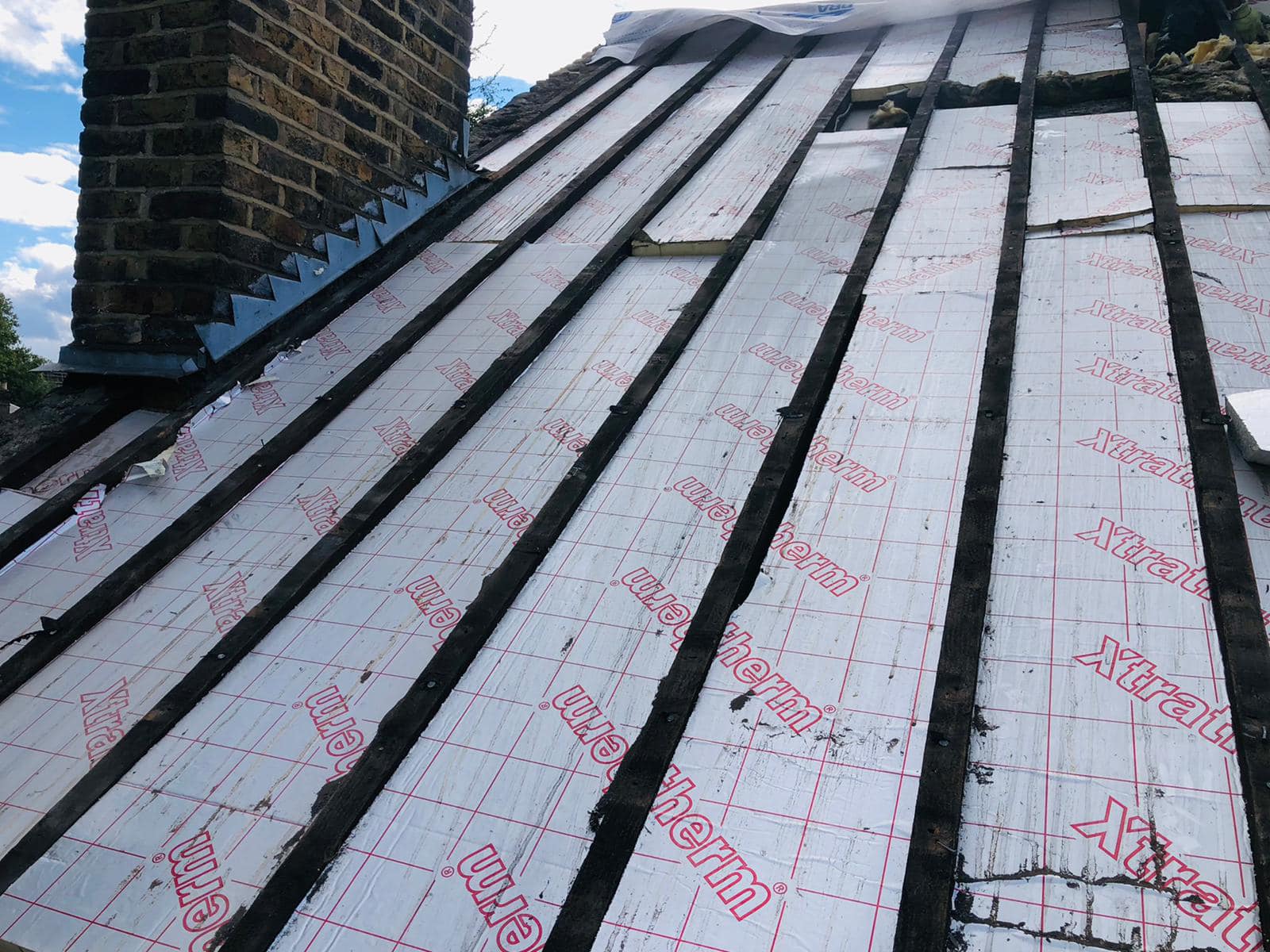 Professional roofers working on a property in London - KS Roof Master
