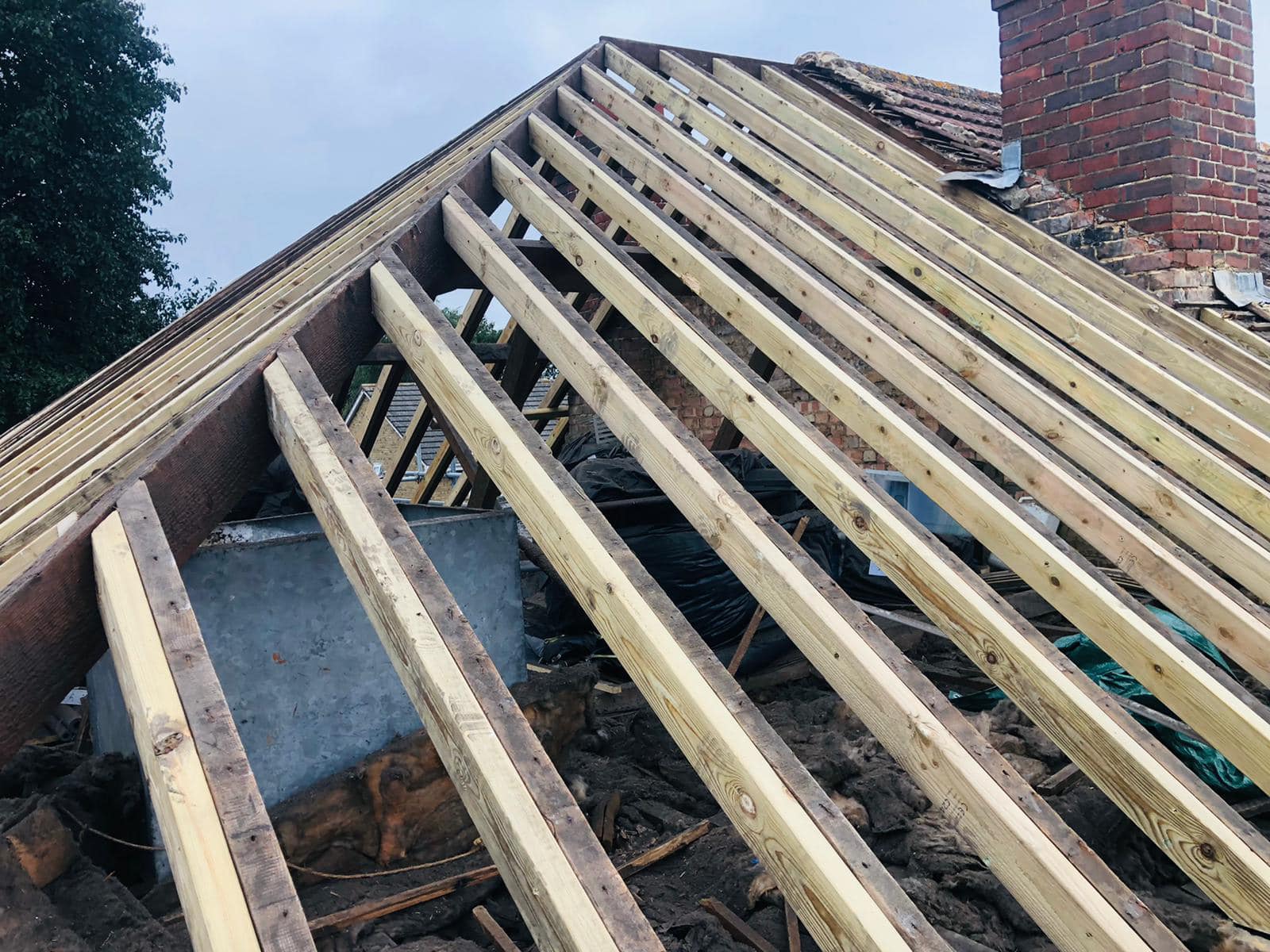 Professional roofers working on a property in London - KS Roof Master