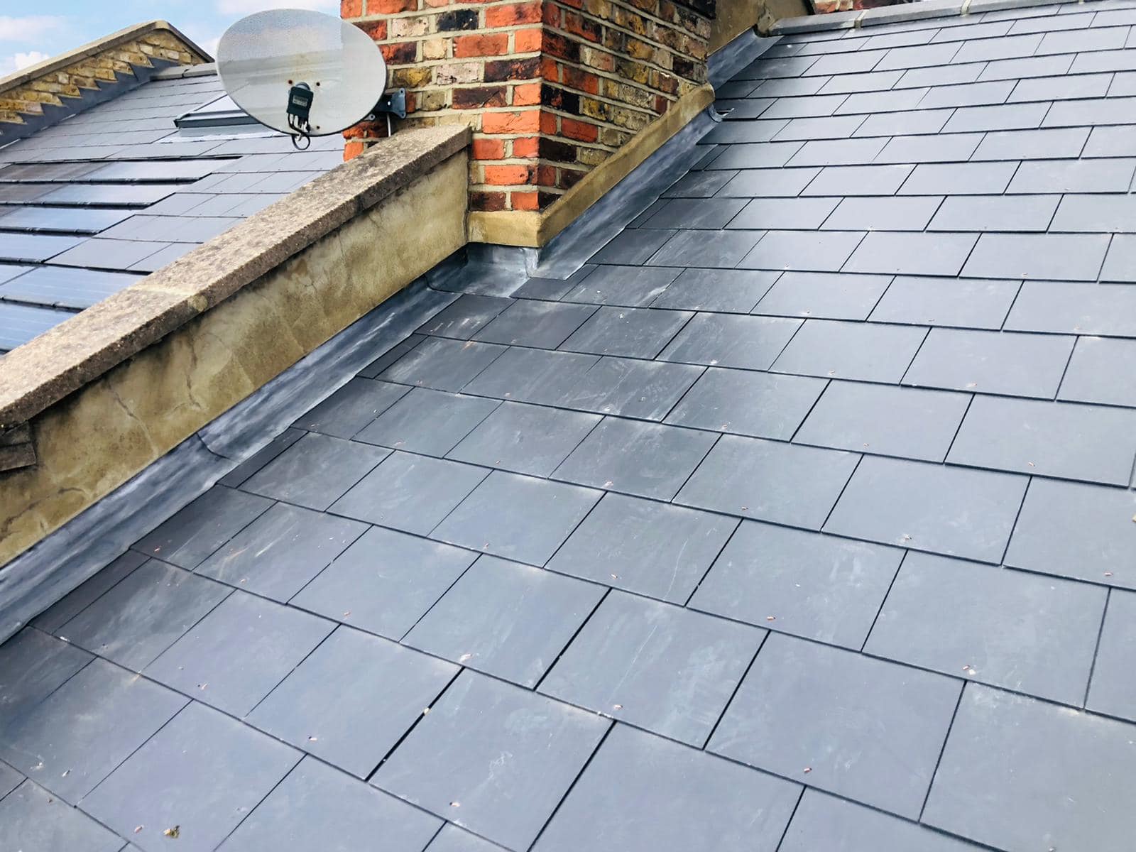 Professional roofers working on a property in London - KS Roof Master