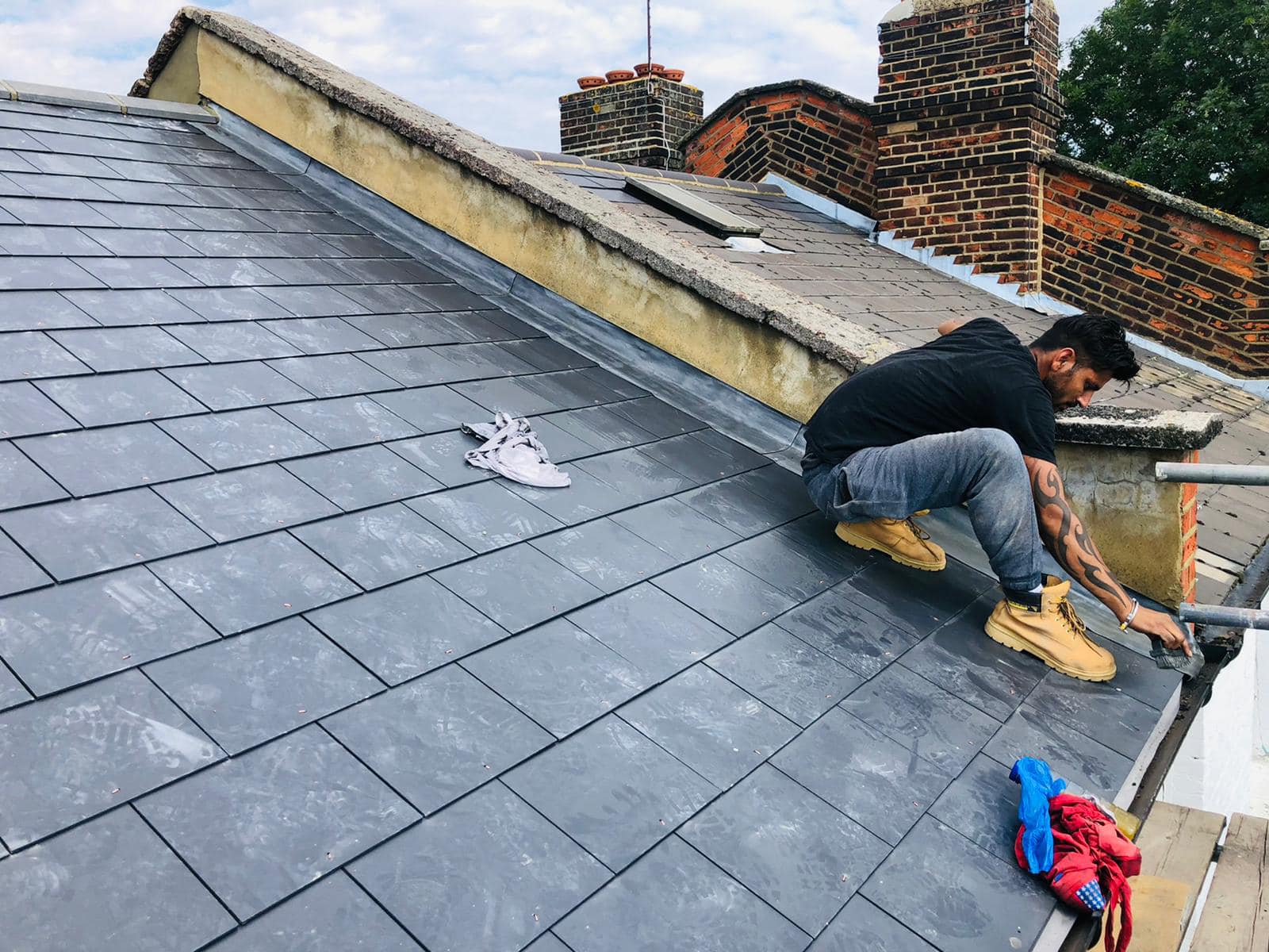 Professional roofers working on a property in London - KS Roof Master