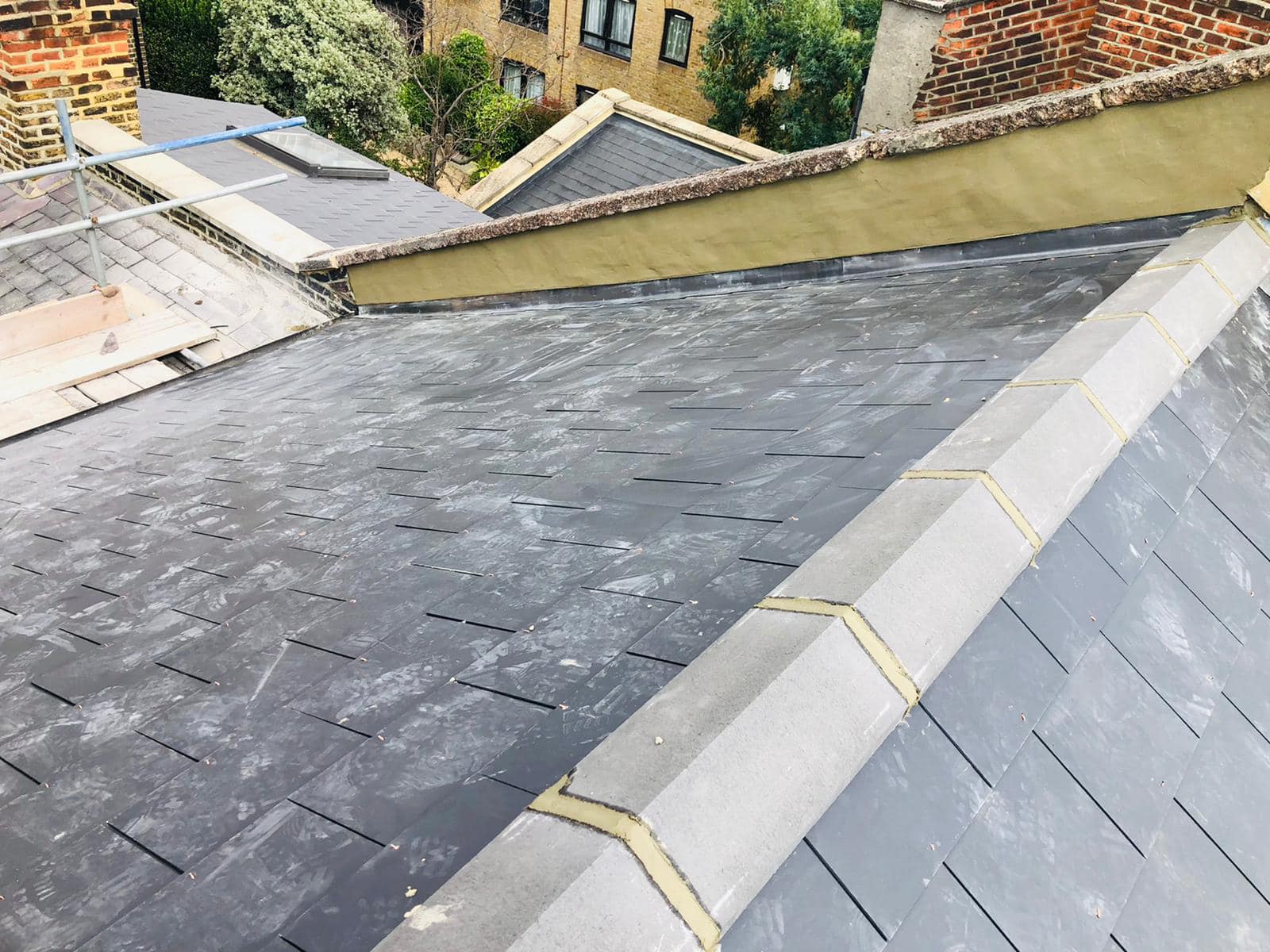 Professional roofers working on a property in London - KS Roof Master