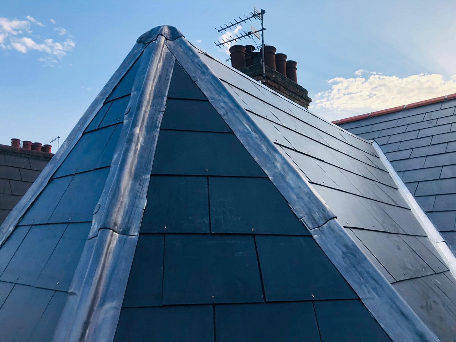 Professional roofers working on a property in London - KS Roof Master