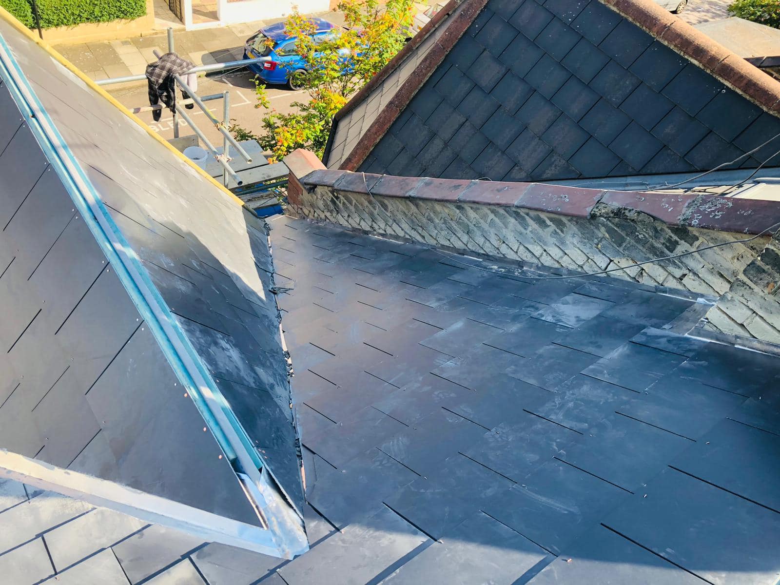 Professional roofers working on a property in London - KS Roof Master