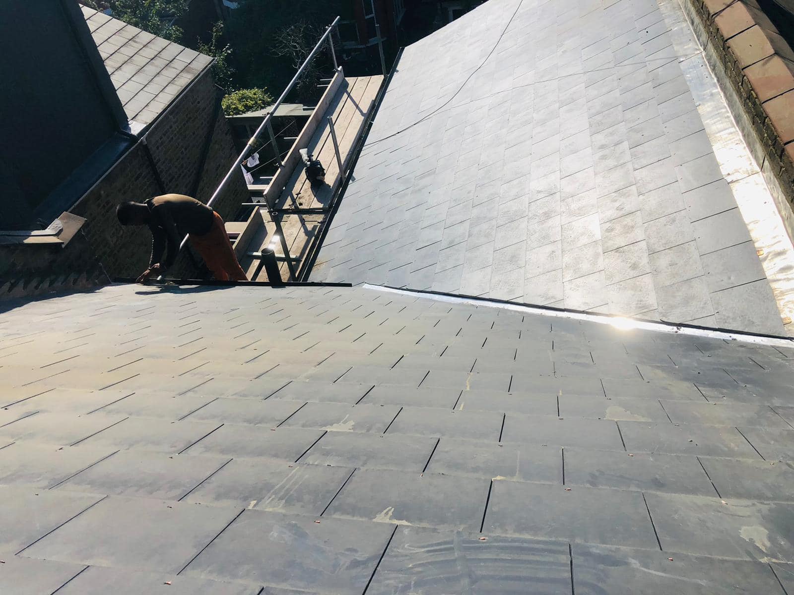 Professional roofers working on a property in London - KS Roof Master