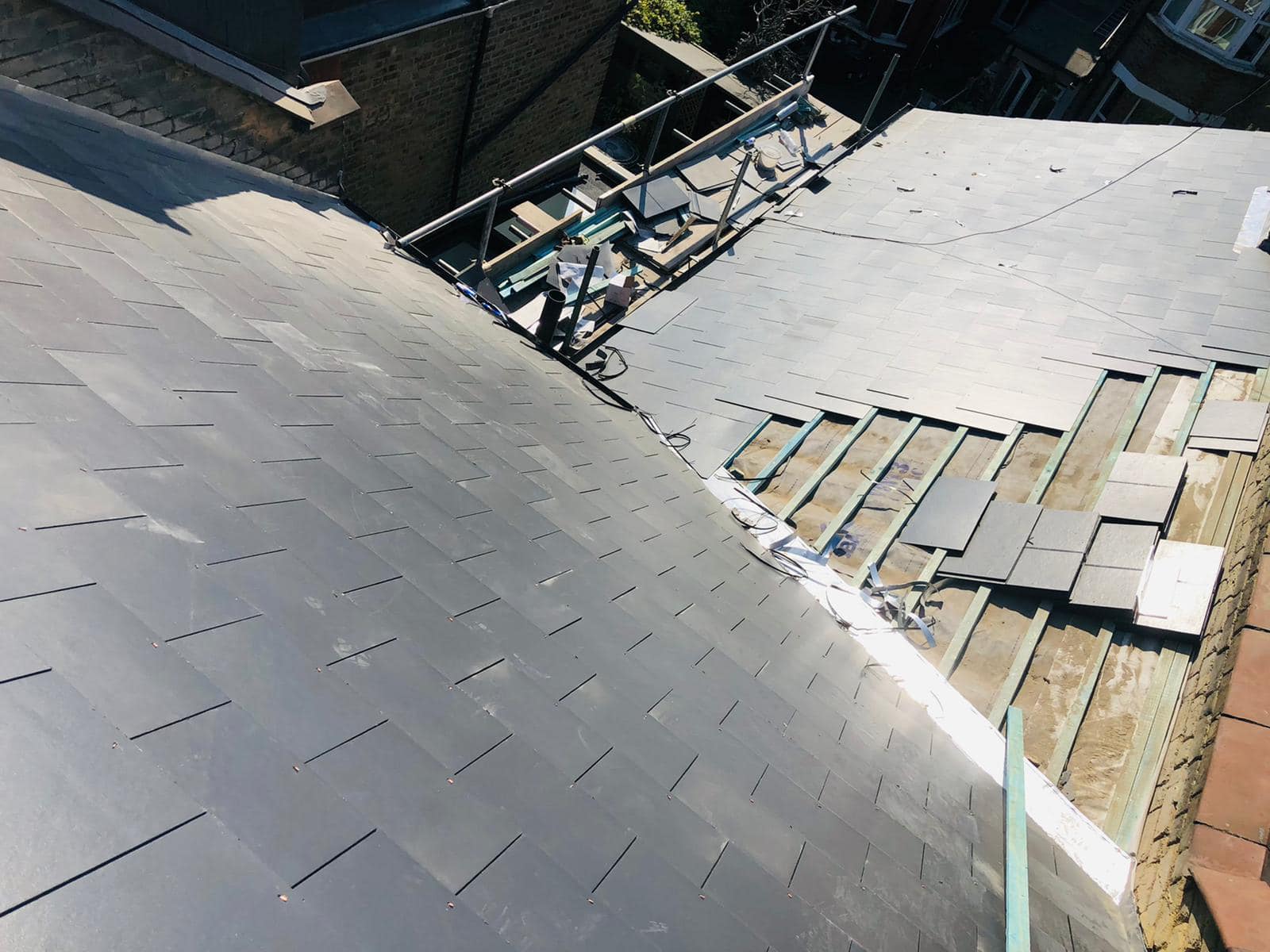 Professional roofers working on a property in London - KS Roof Master