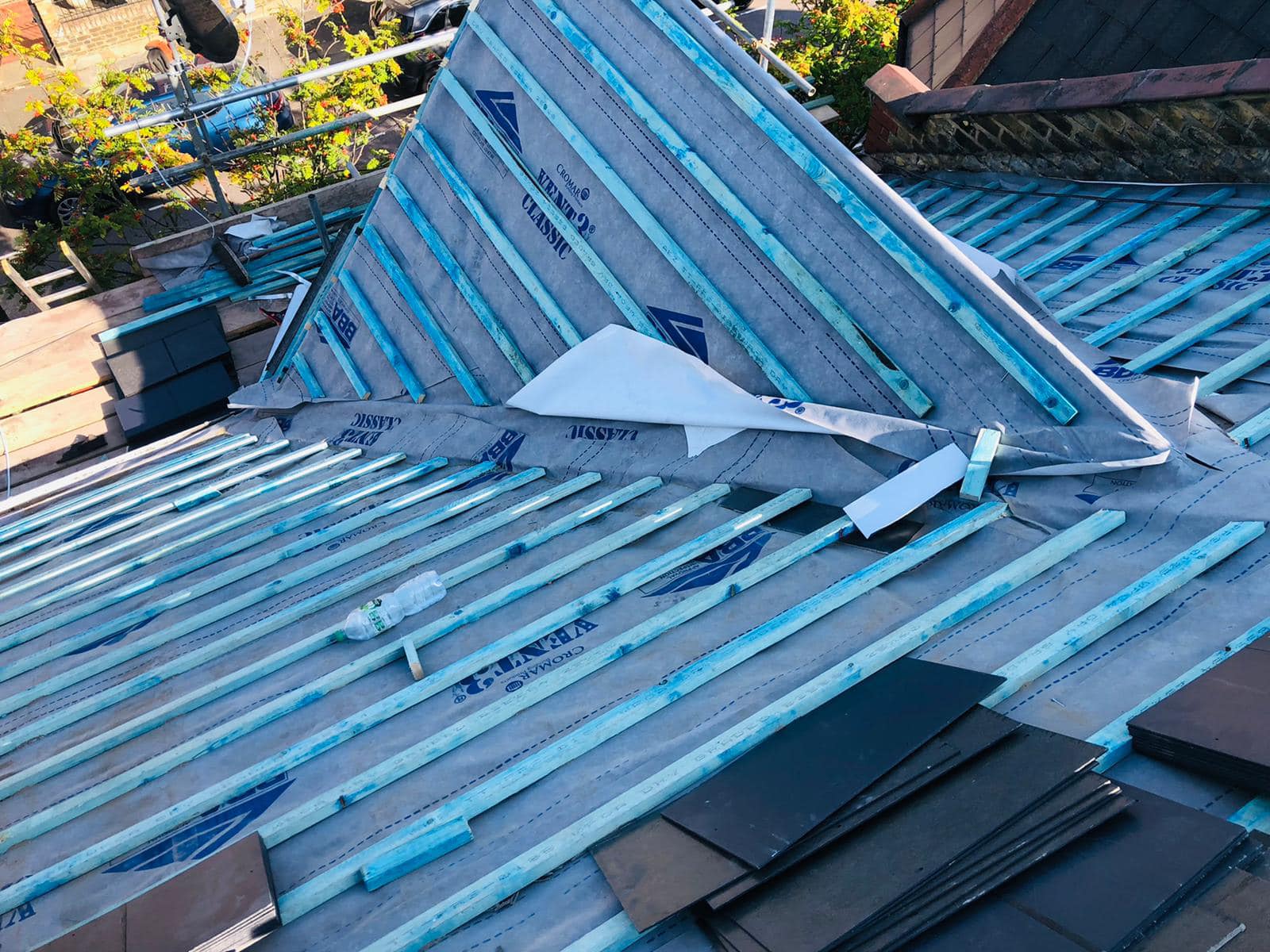 Professional roofers working on a property in London - KS Roof Master