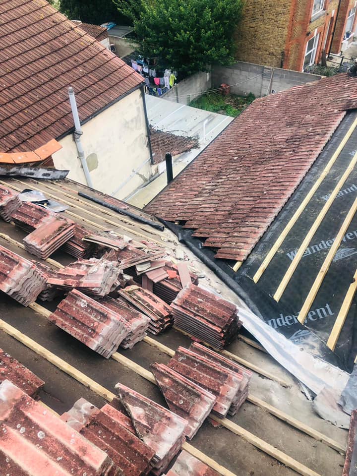 Professional roofers working on a property in London - KS Roof Master