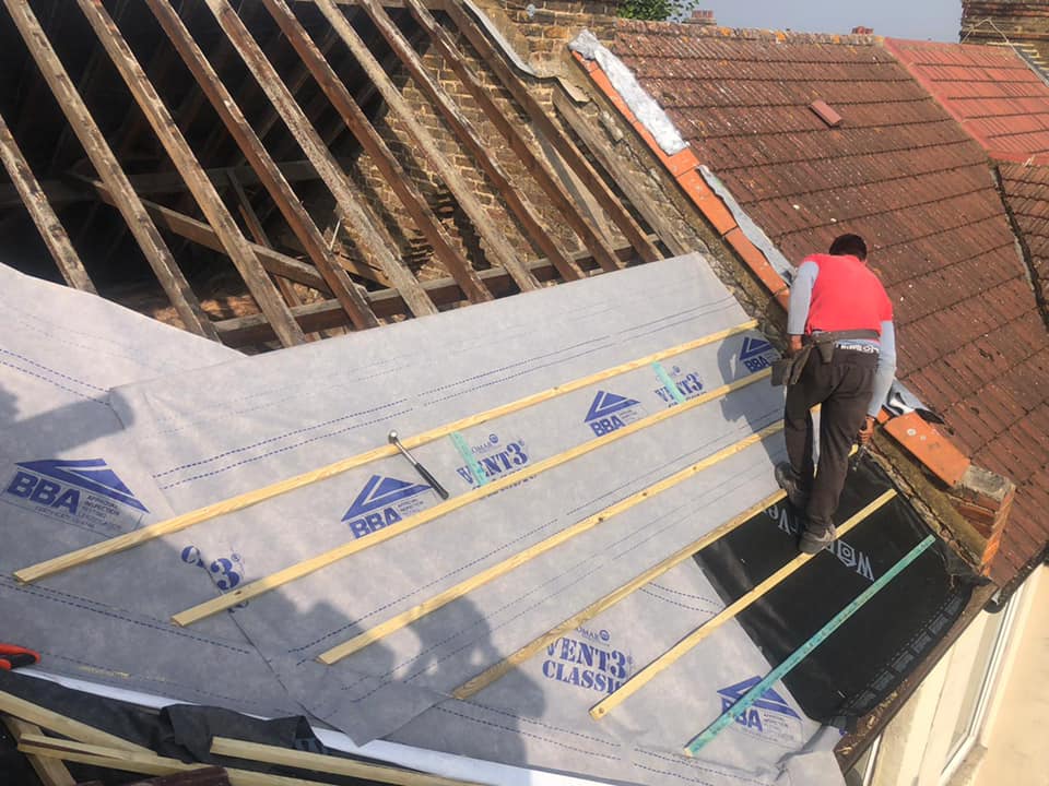 Professional roofers working on a property in London - KS Roof Master