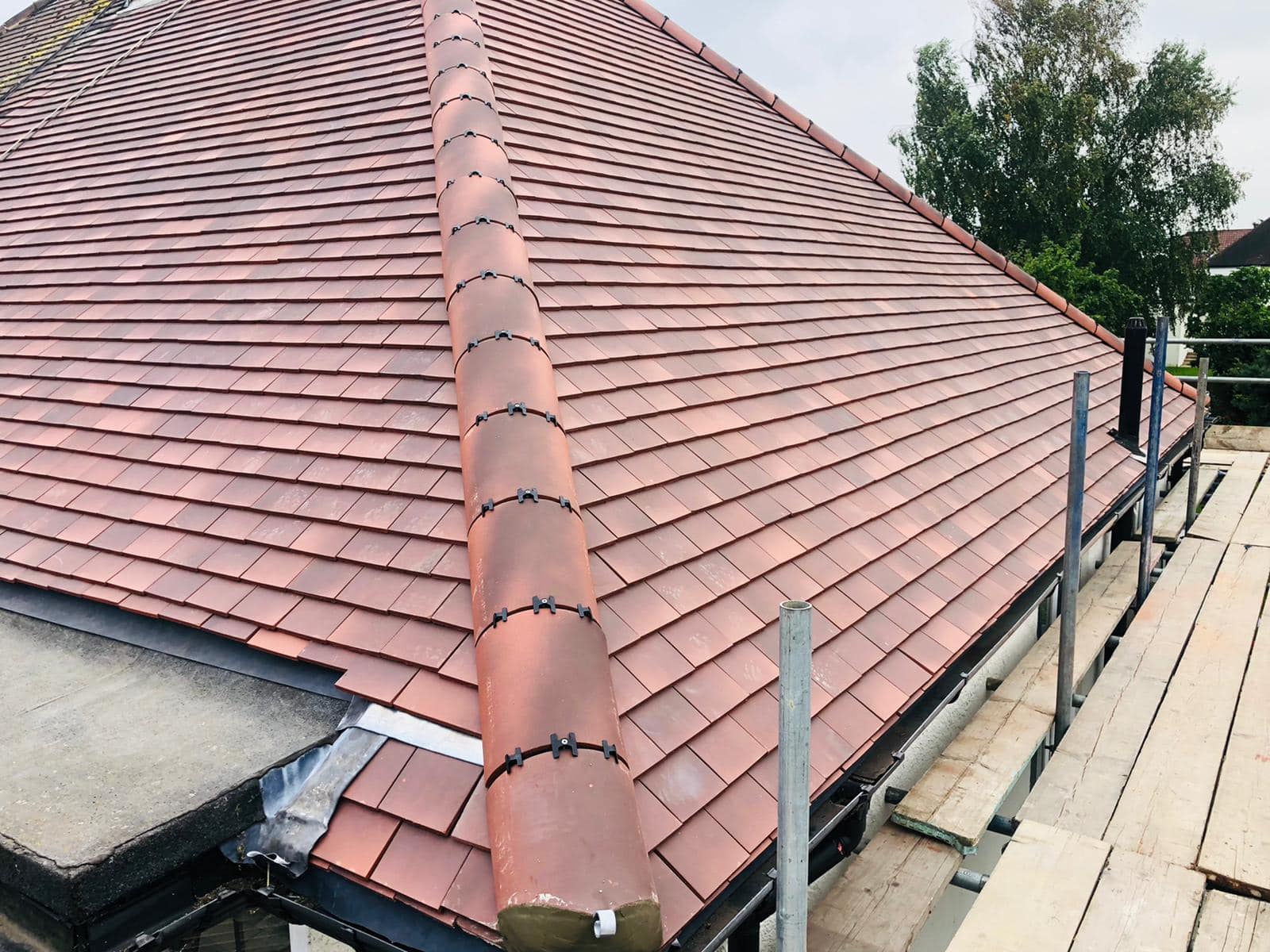 Professional roofers working on a property in London - KS Roof Master