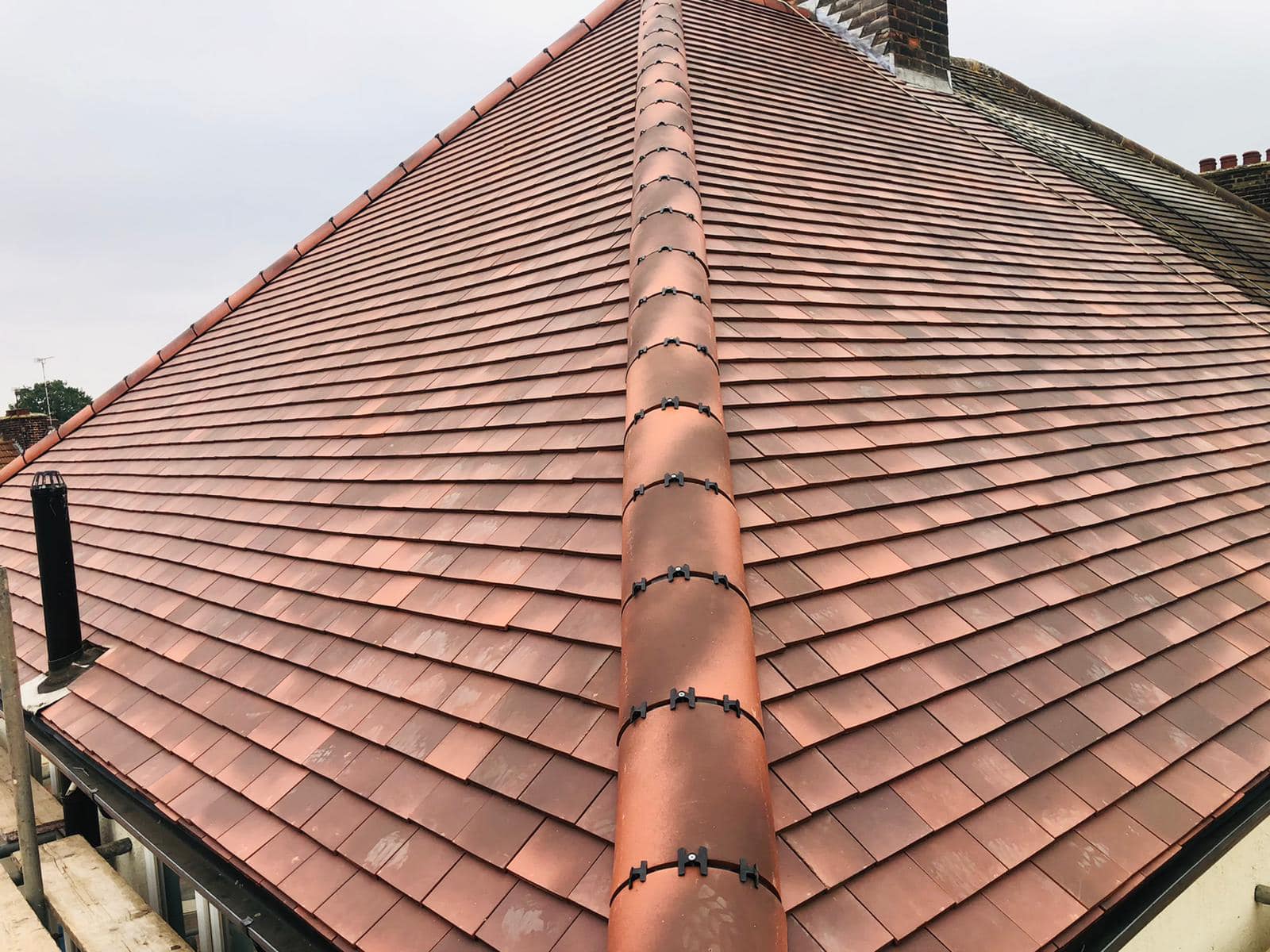 Professional roofers working on a property in London - KS Roof Master