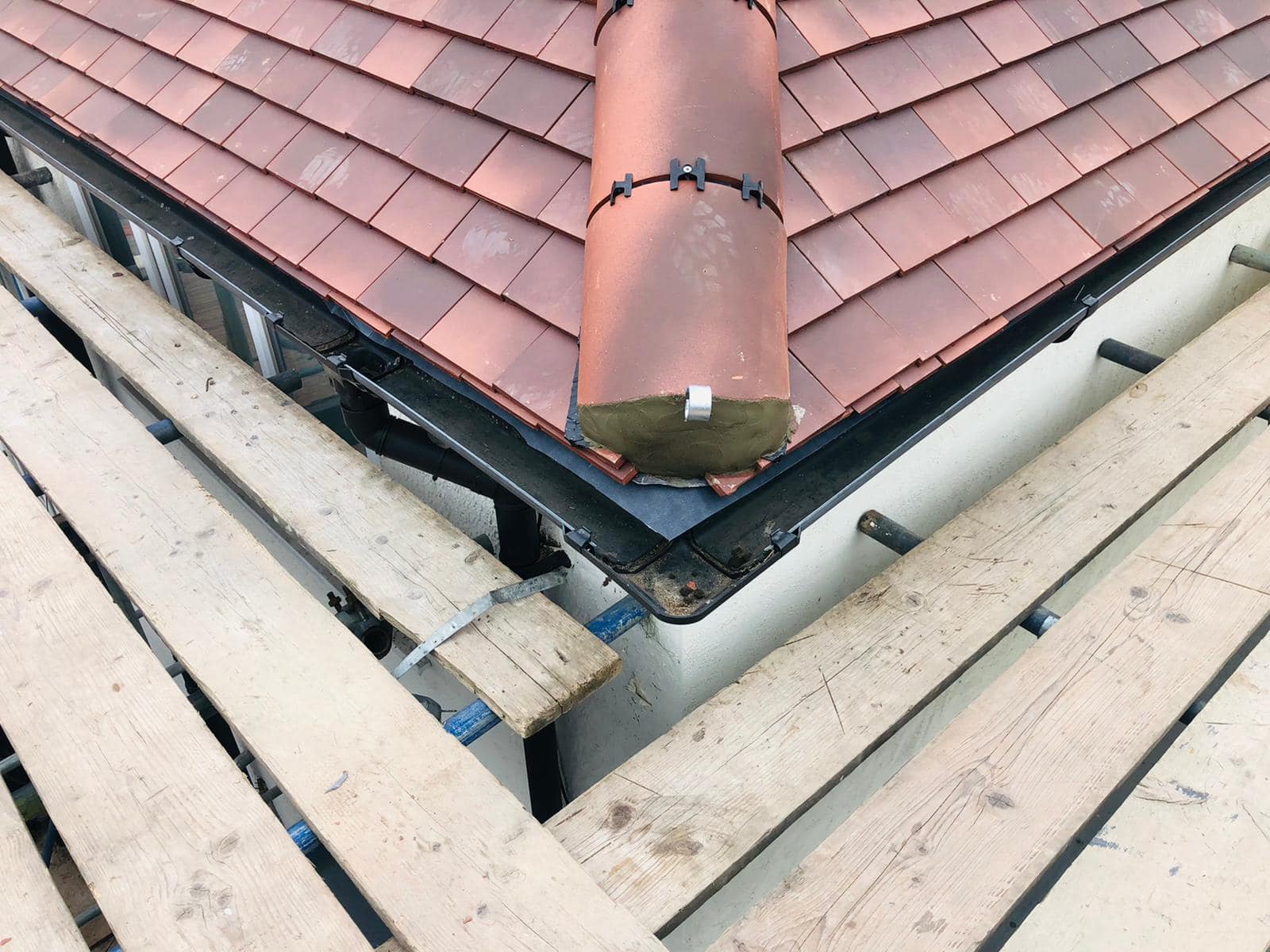 Professional roofers working on a property in London - KS Roof Master