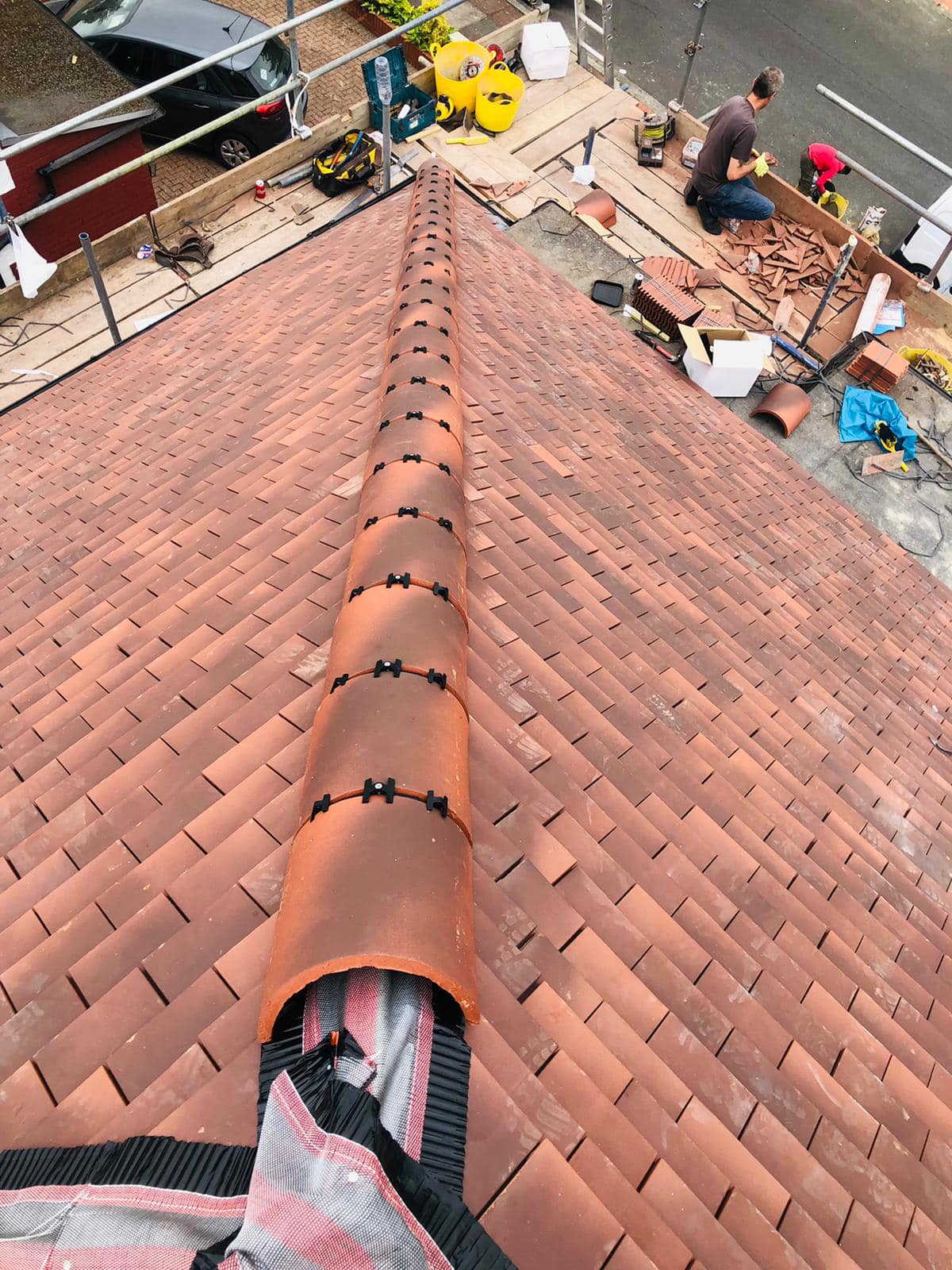 Professional roofers working on a property in London - KS Roof Master