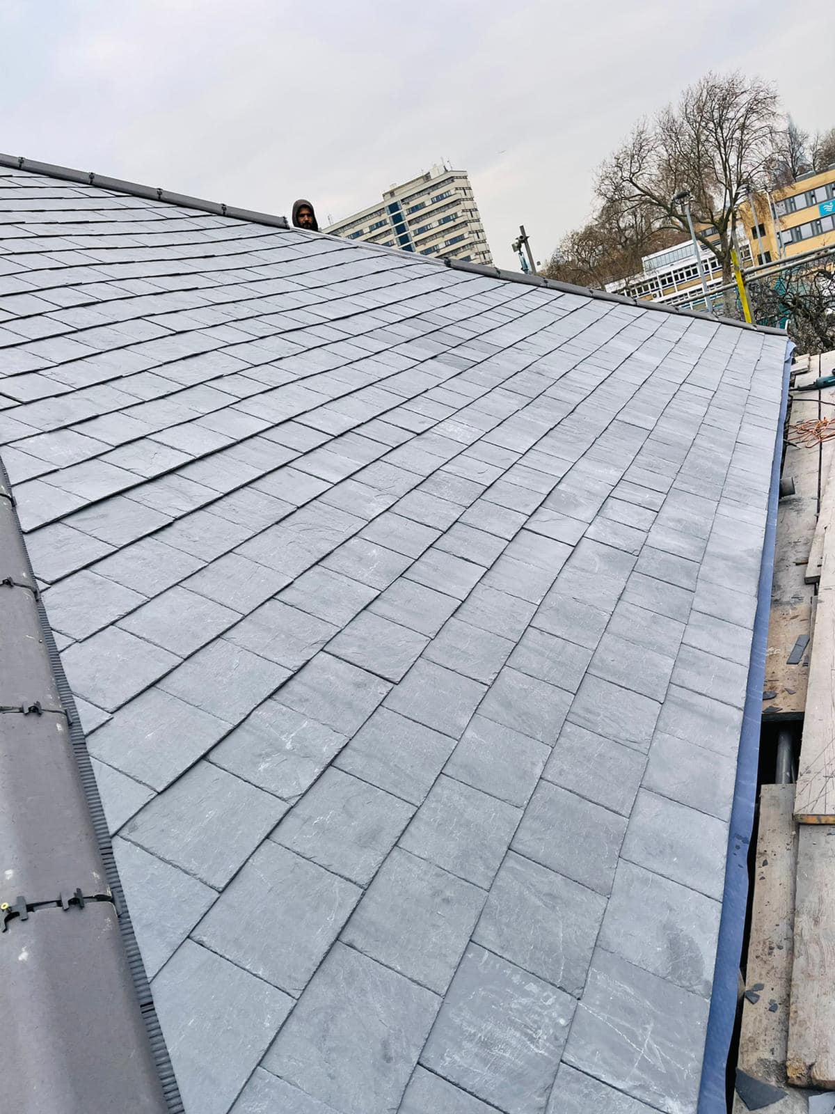 Professional roofers working on a property in London - KS Roof Master