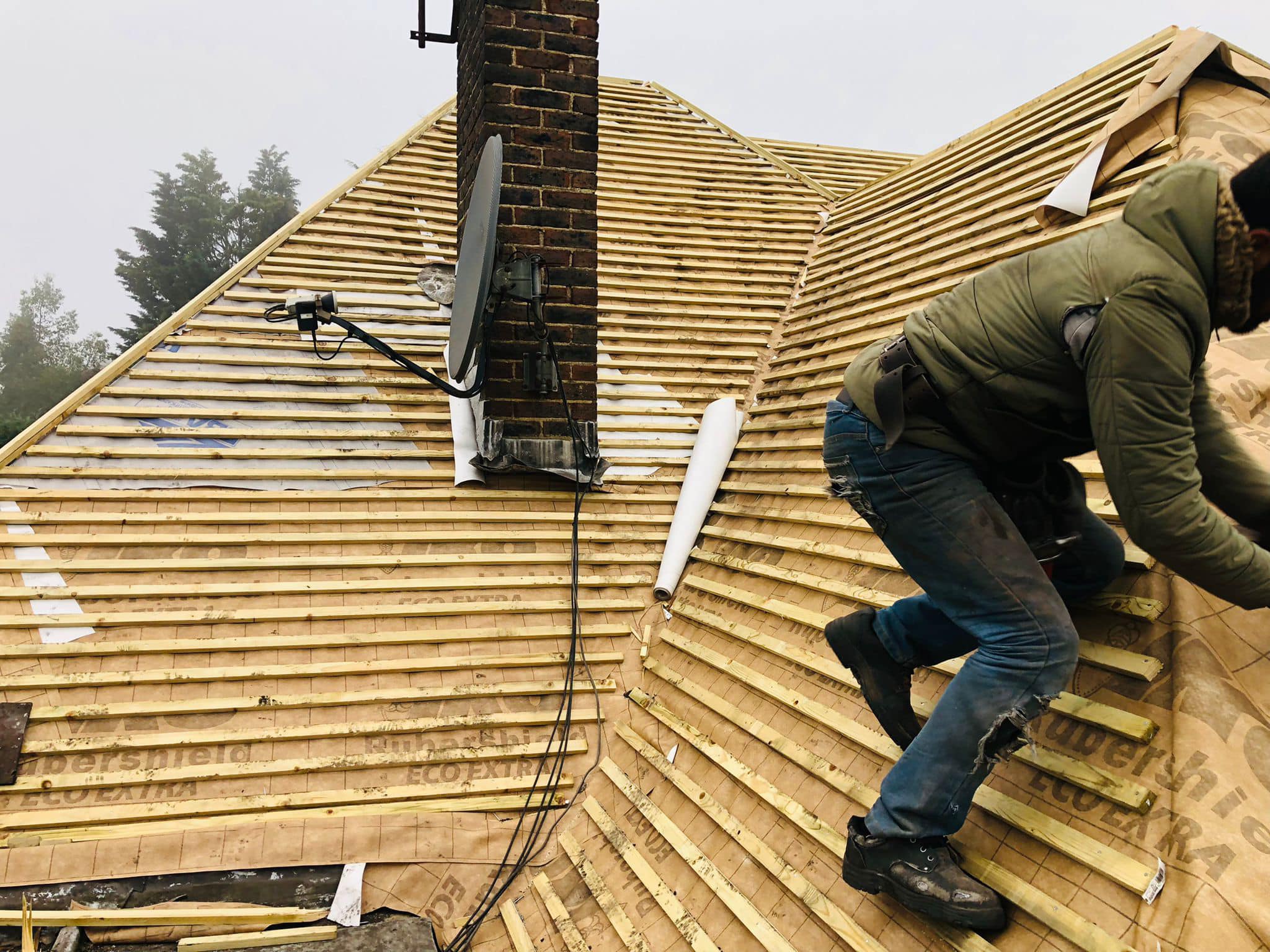 Professional roofers working on a property in London - KS Roof Master
