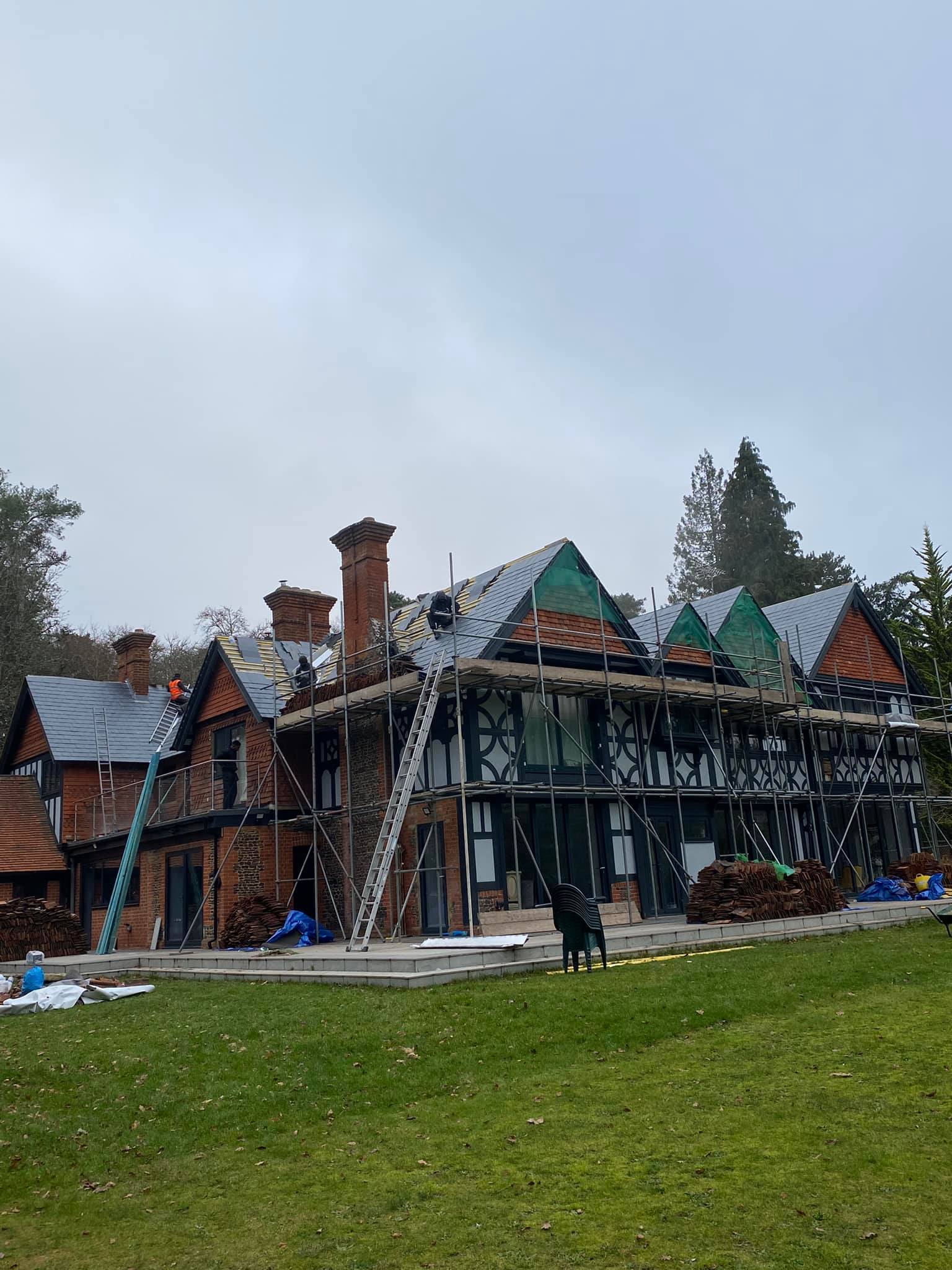 Professional roofers working on a property in London - KS Roof Master