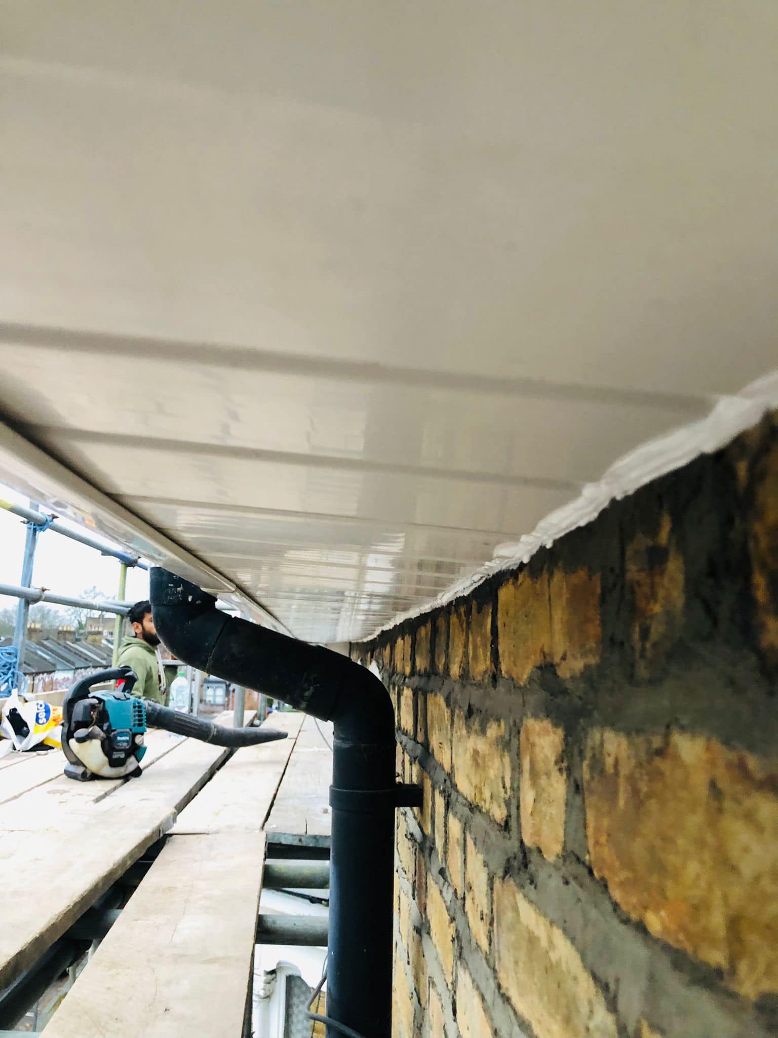 Professional roofers working on a property in London - KS Roof Master