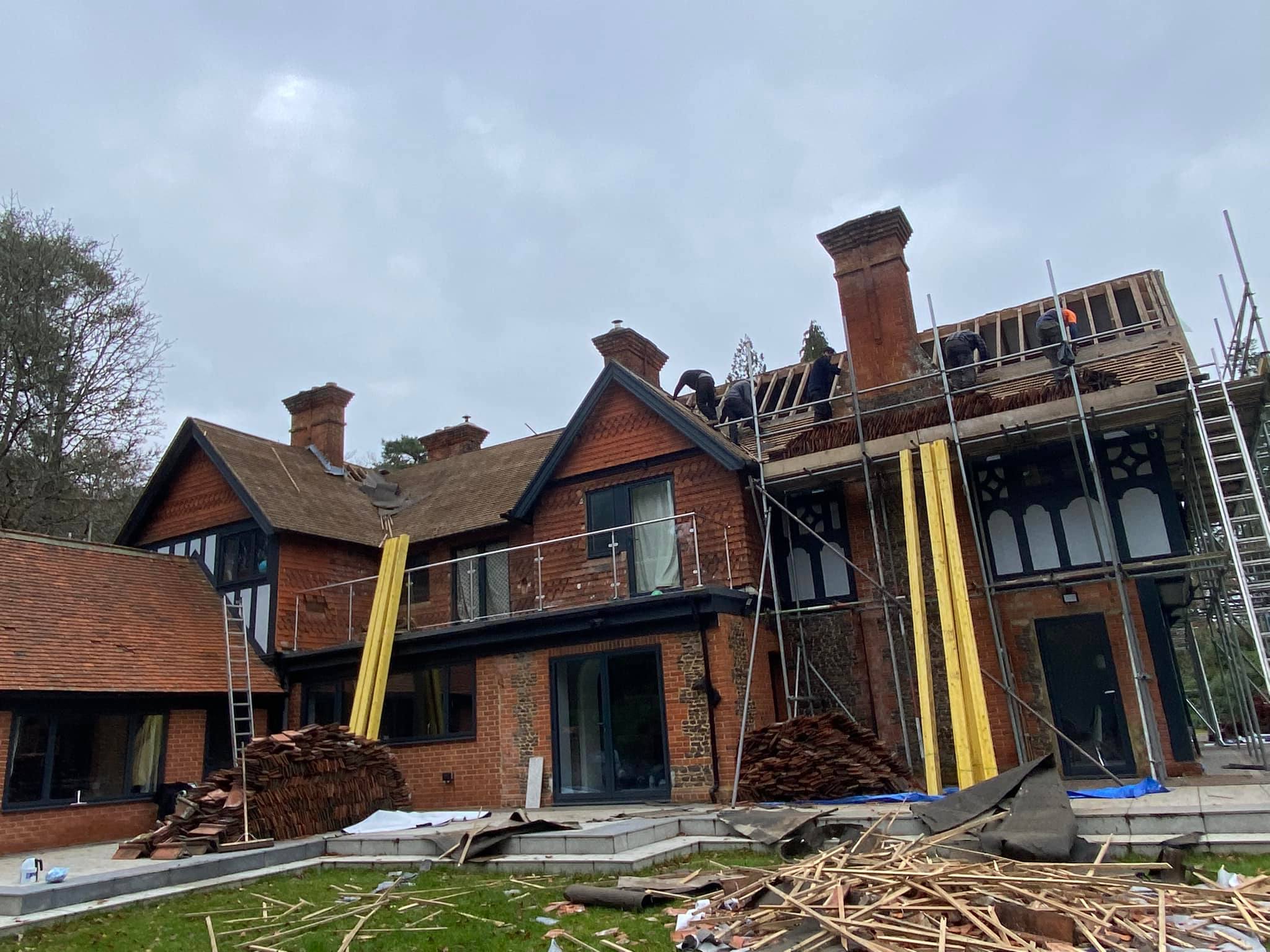 Professional roofers working on a property in London - KS Roof Master