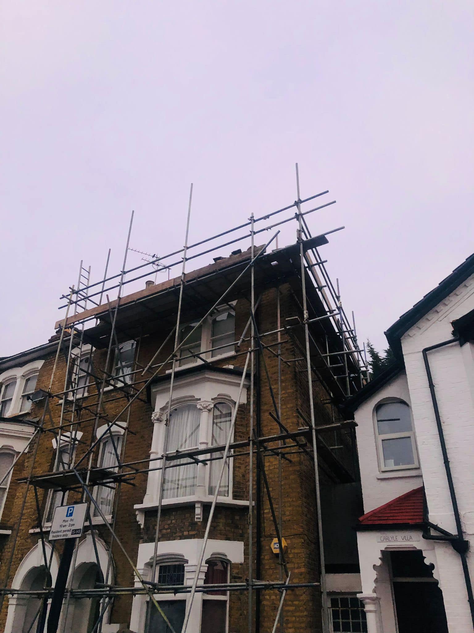 Professional roofers working on a property in London - KS Roof Master