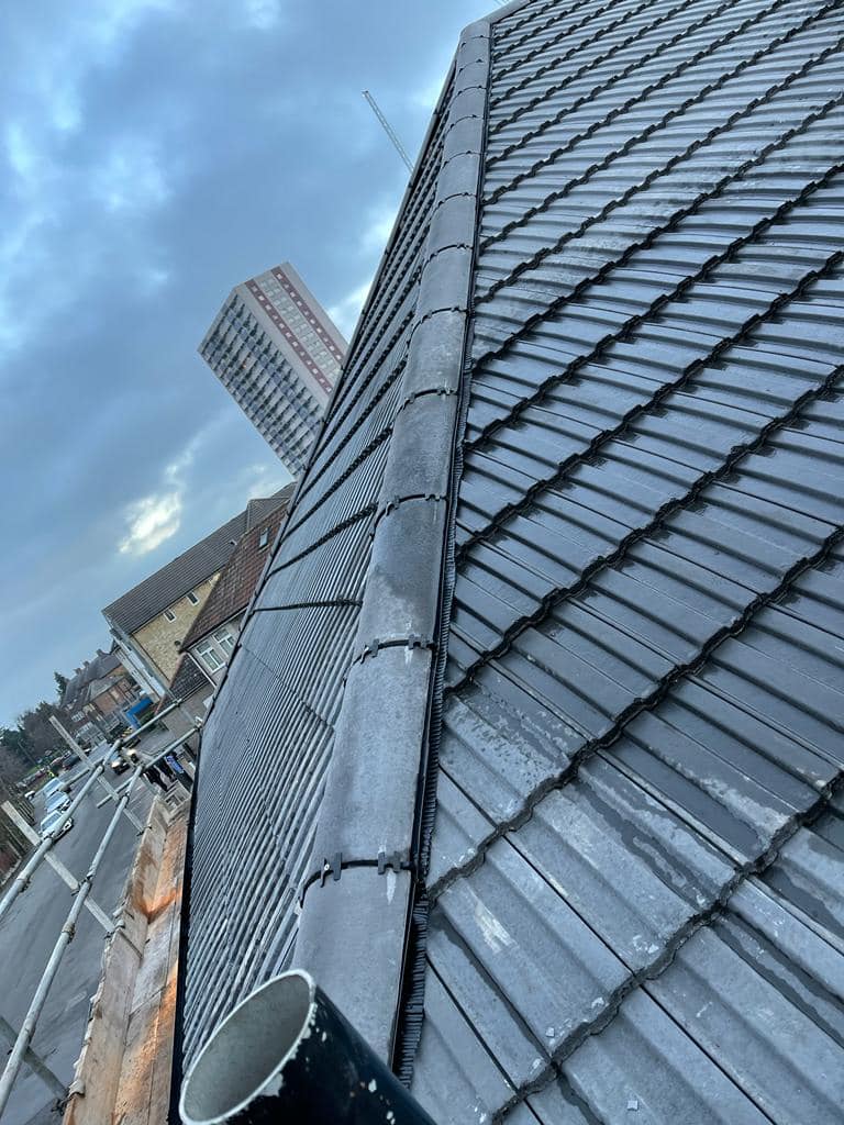 Professional roofers working on a property in London - KS Roof Master