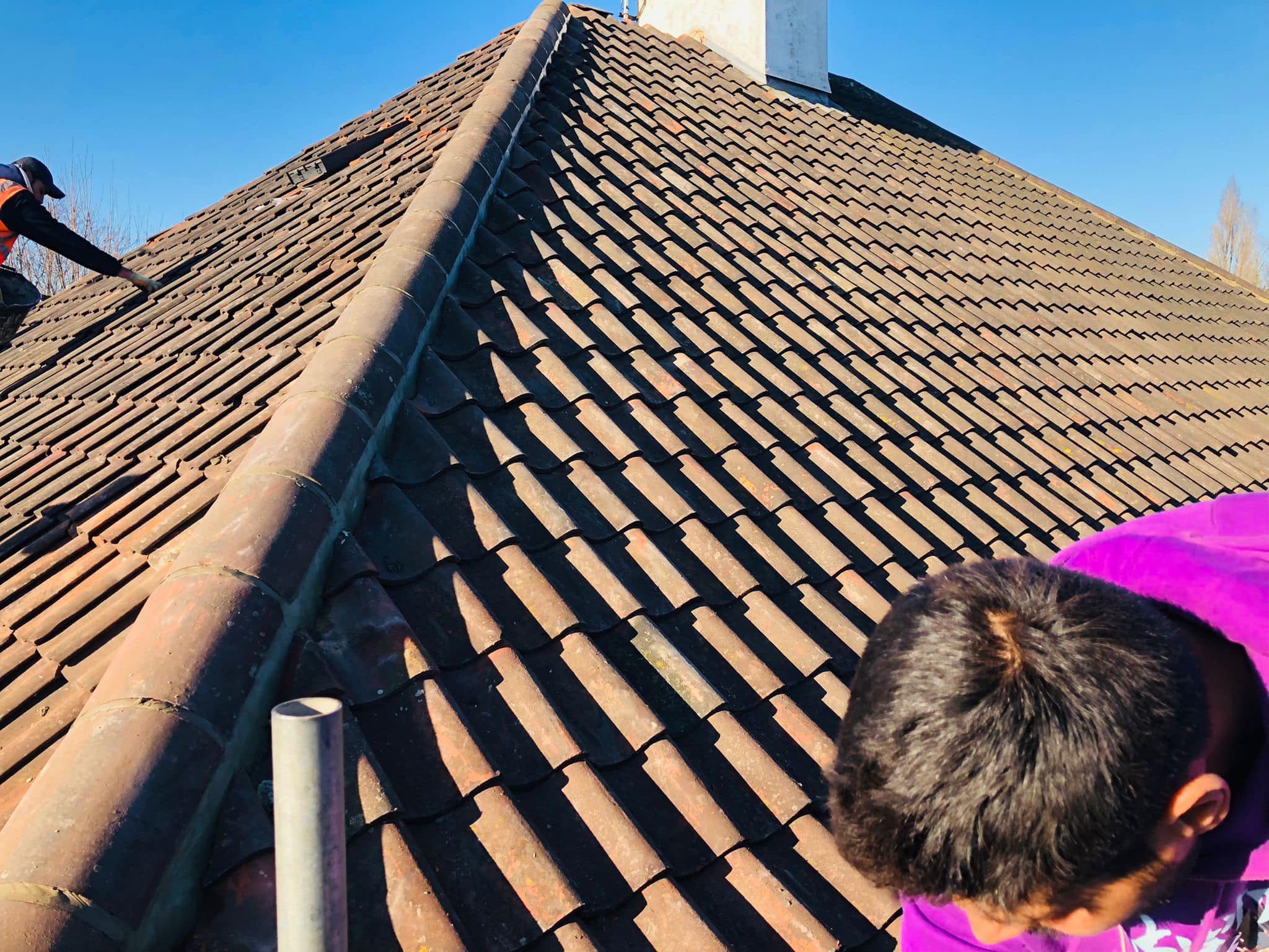Professional roofers working on a property in London - KS Roof Master