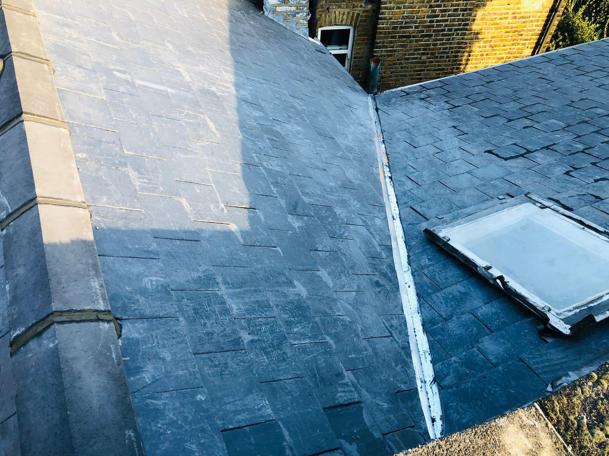 Professional roofers working on a property in London - KS Roof Master