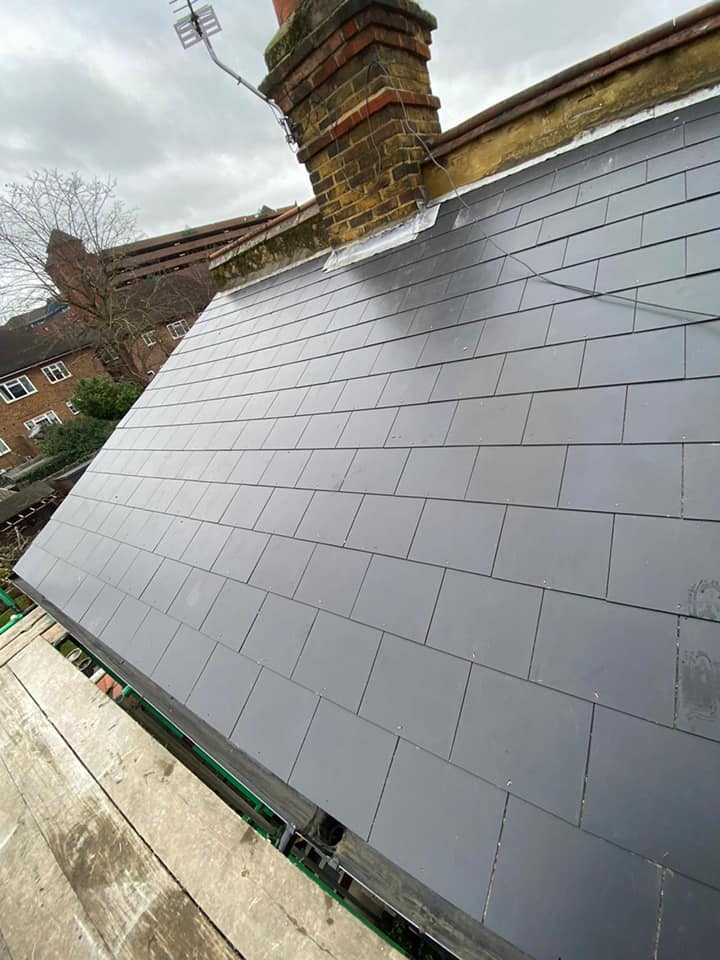 Professional roofers working on a property in London - KS Roof Master