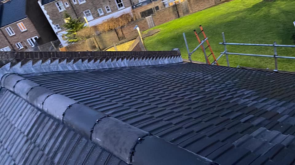 Professional roofers working on a property in London - KS Roof Master