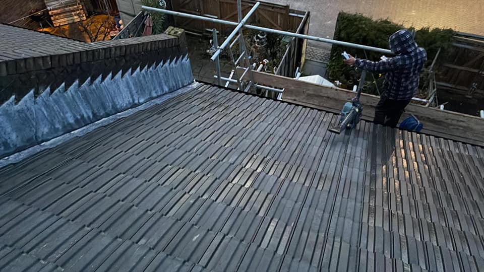 Professional roofers working on a property in London - KS Roof Master