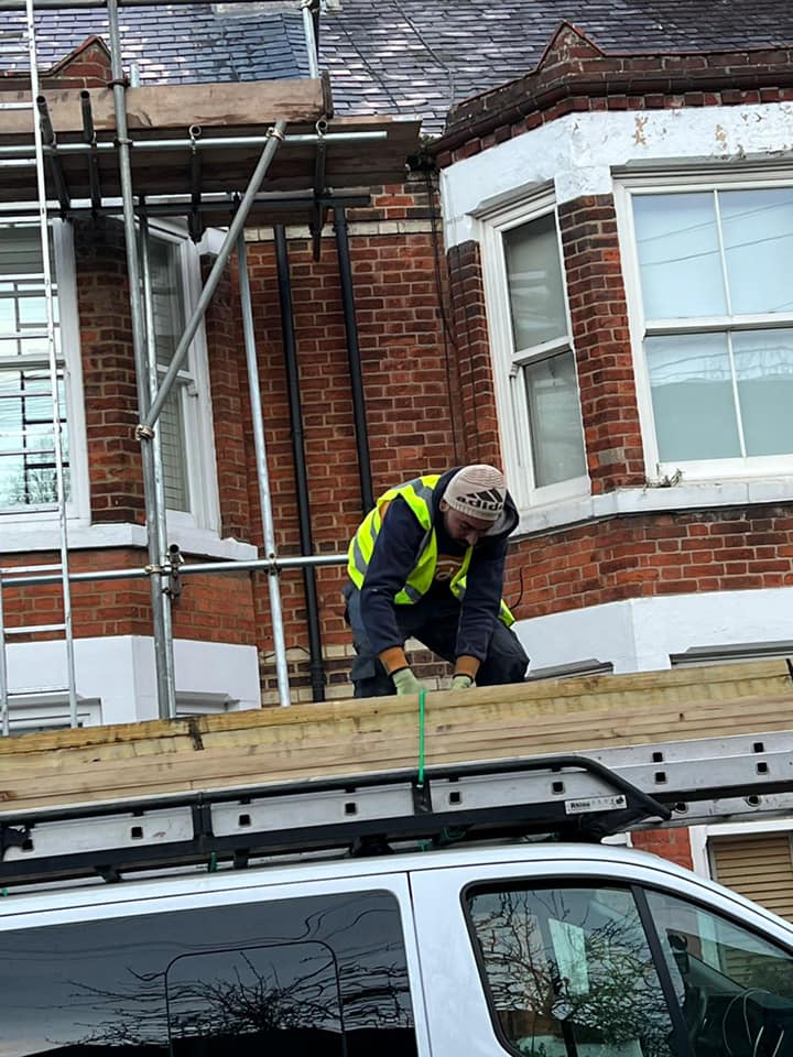 Professional roofers working on a property in London - KS Roof Master