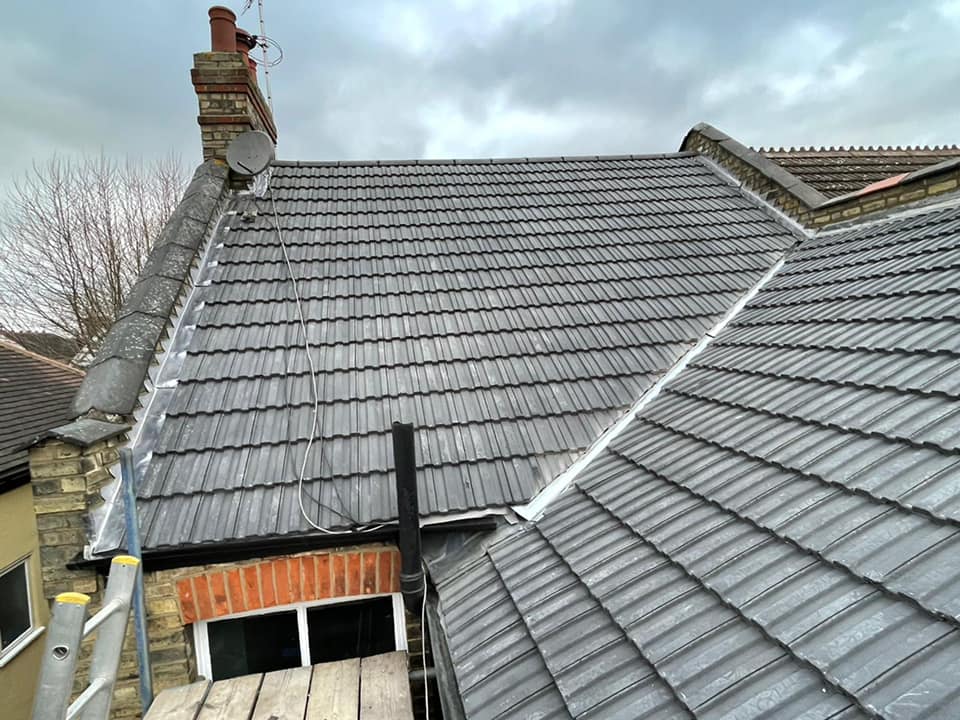 Professional roofers working on a property in London - KS Roof Master