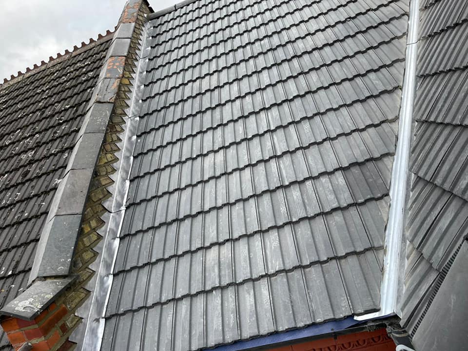 Professional roofers working on a property in London - KS Roof Master