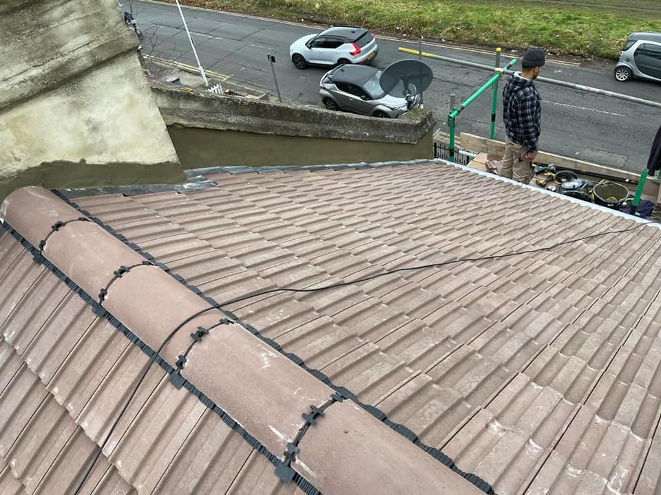 Professional roofers working on a property in London - KS Roof Master