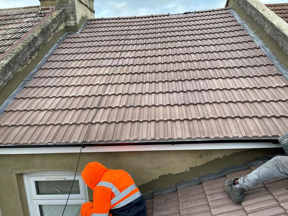 Professional roofers working on a property in London - KS Roof Master