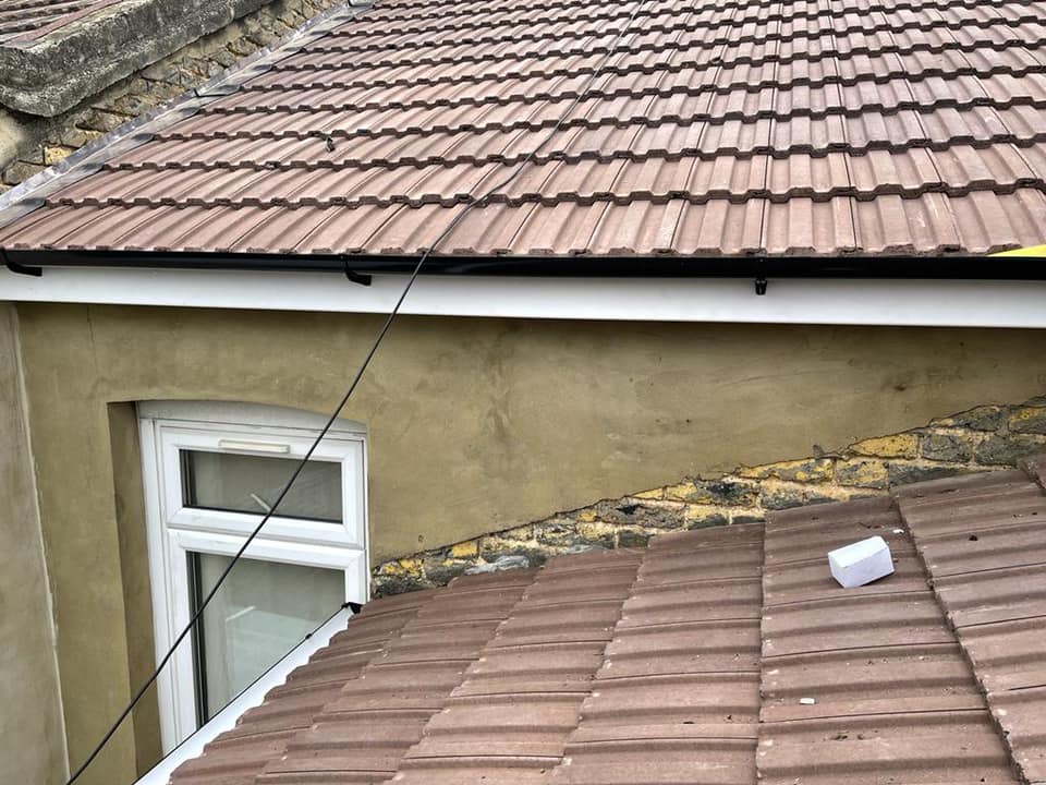 Professional roofers working on a property in London - KS Roof Master