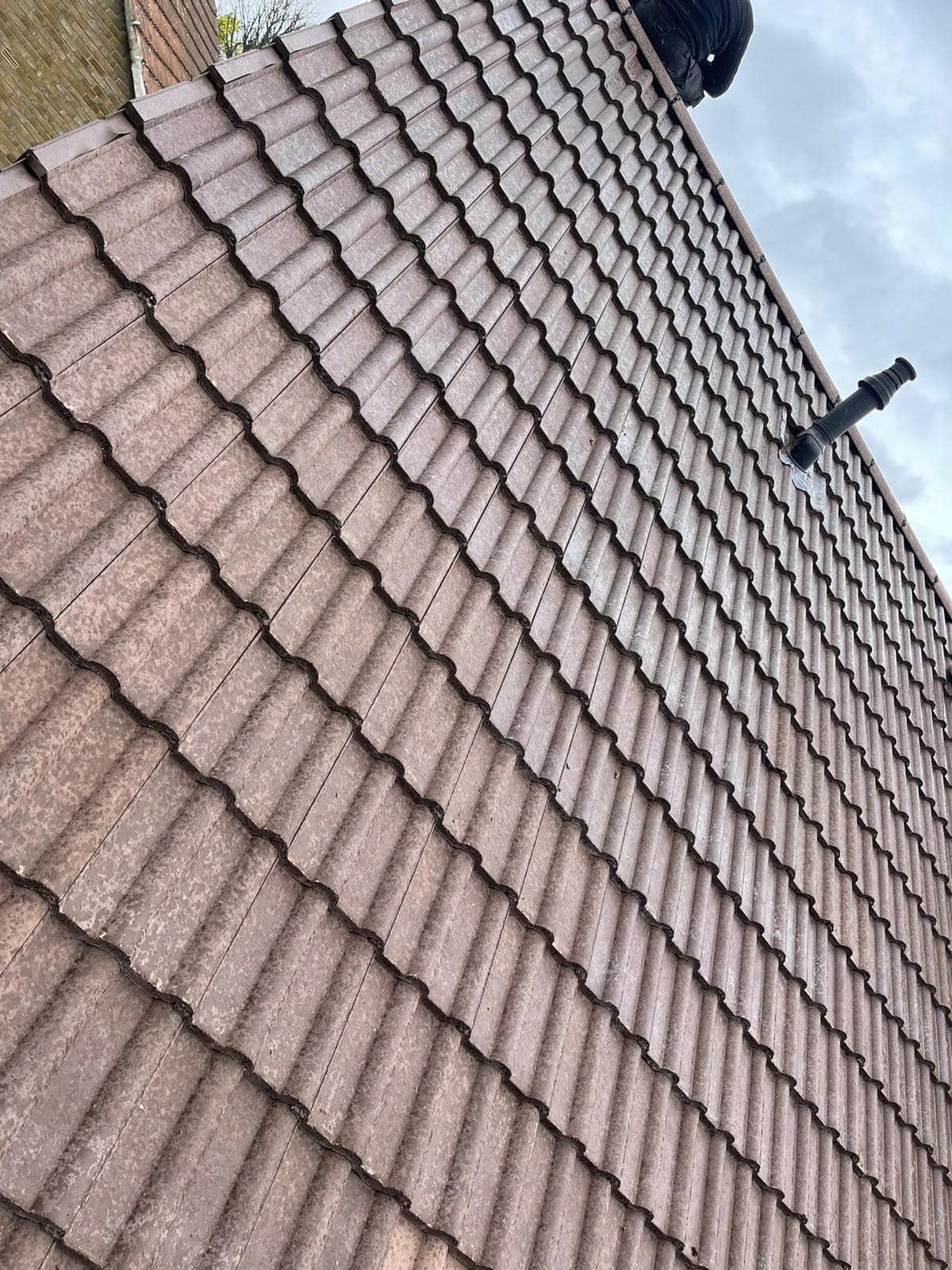 Professional roofers working on a property in London - KS Roof Master