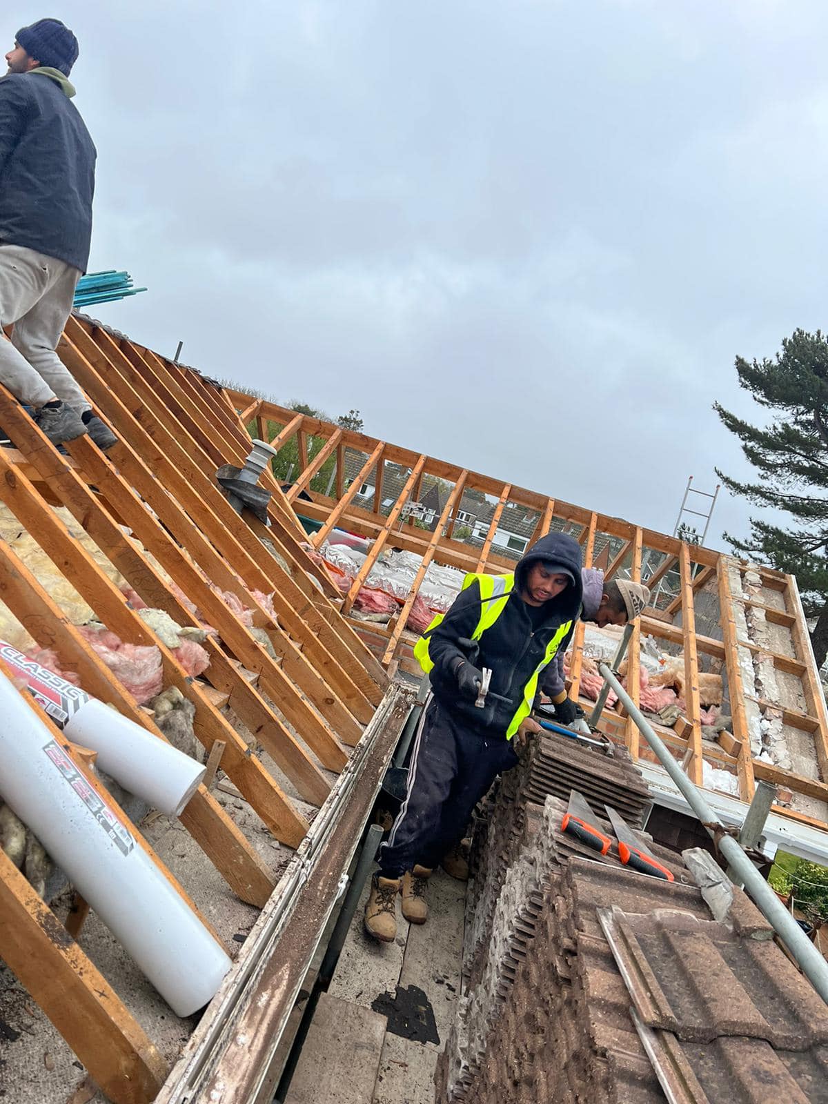 Professional roofers working on a property in London - KS Roof Master