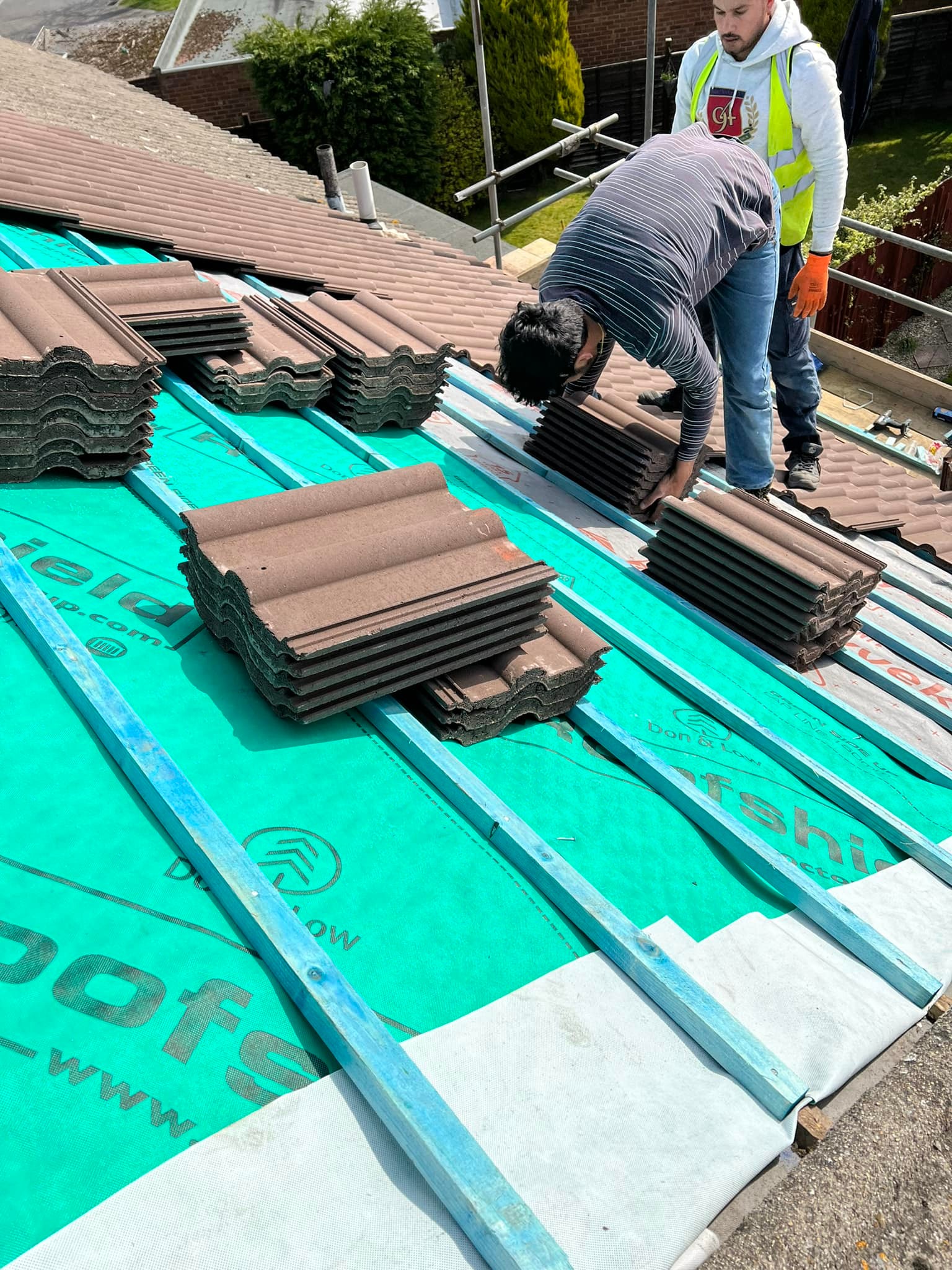 Professional roofers working on a property in London - KS Roof Master