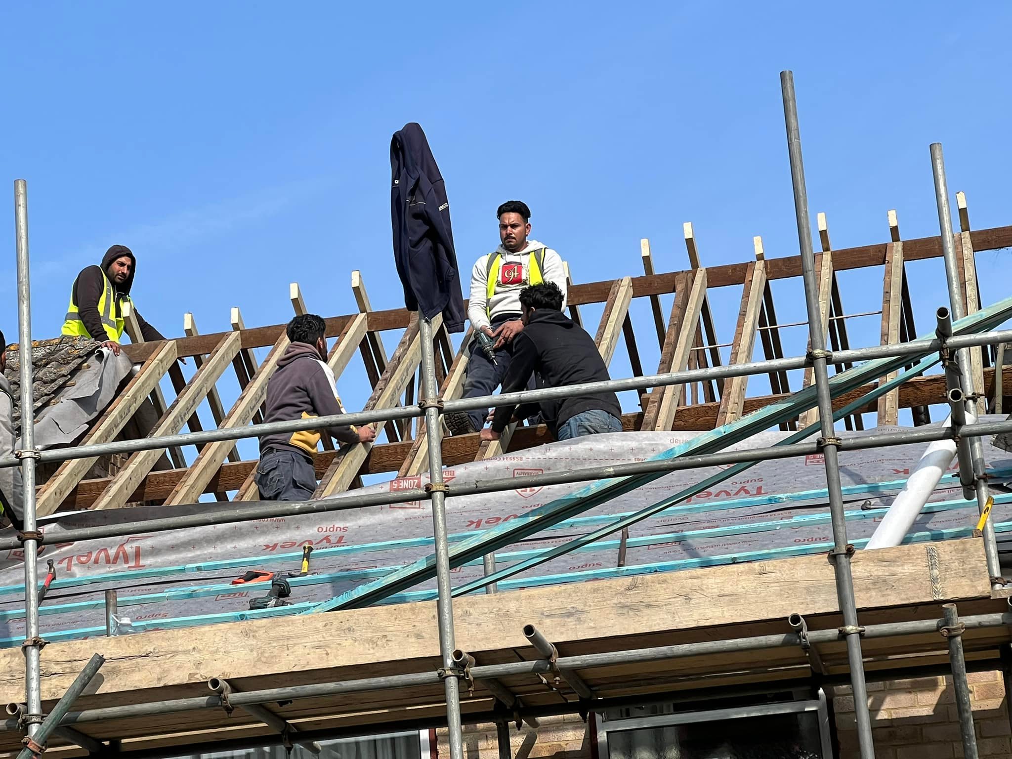 Professional roofers working on a property in London - KS Roof Master