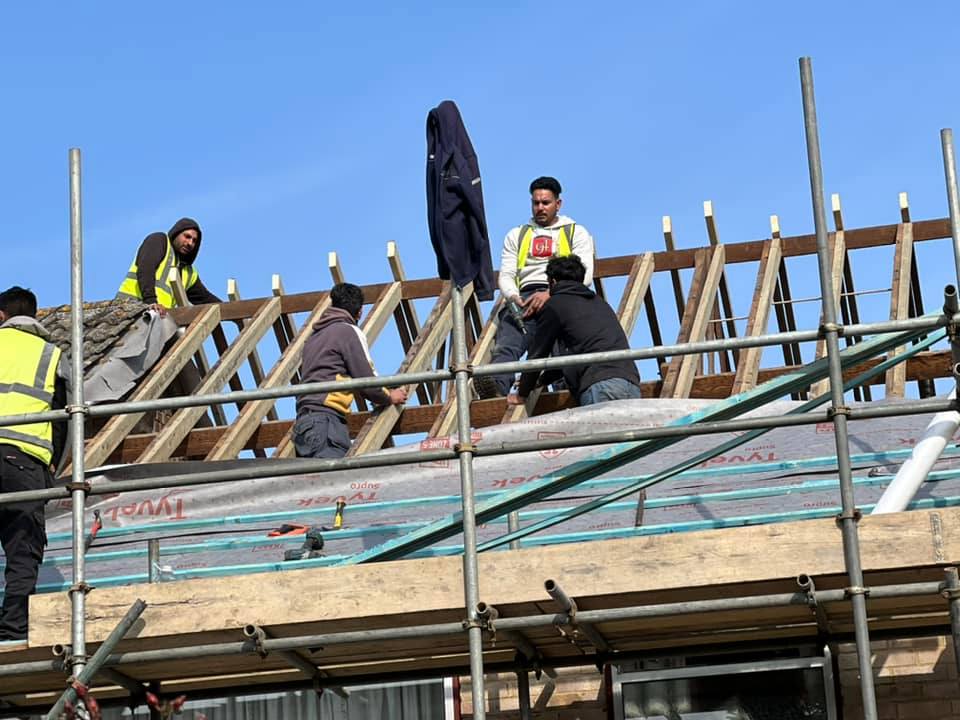 Professional roofers working on a property in London - KS Roof Master