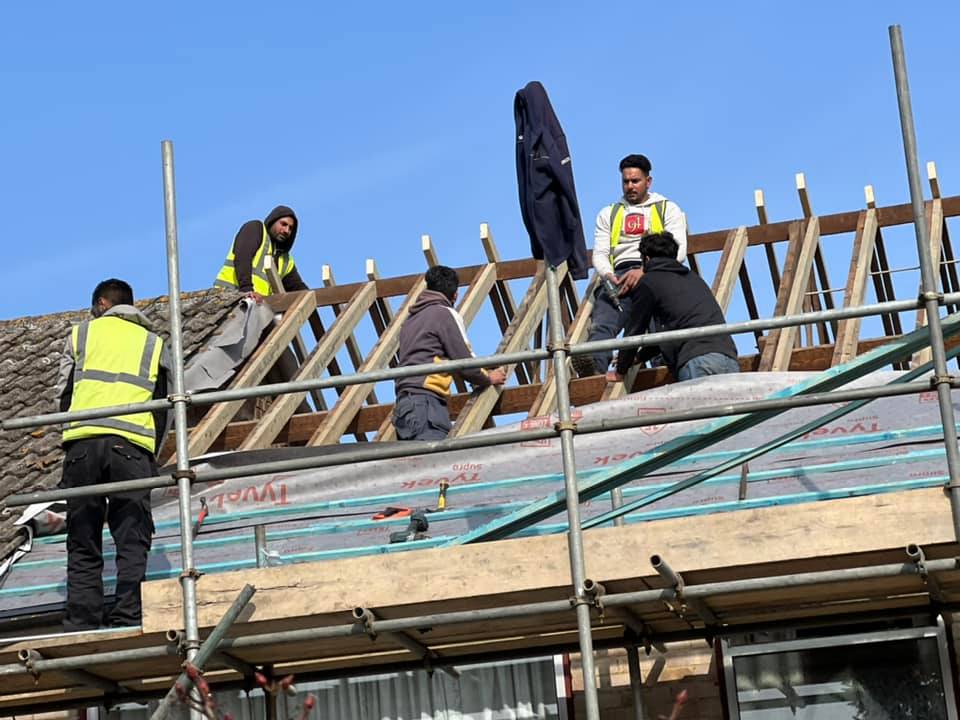 Professional roofers working on a property in London - KS Roof Master