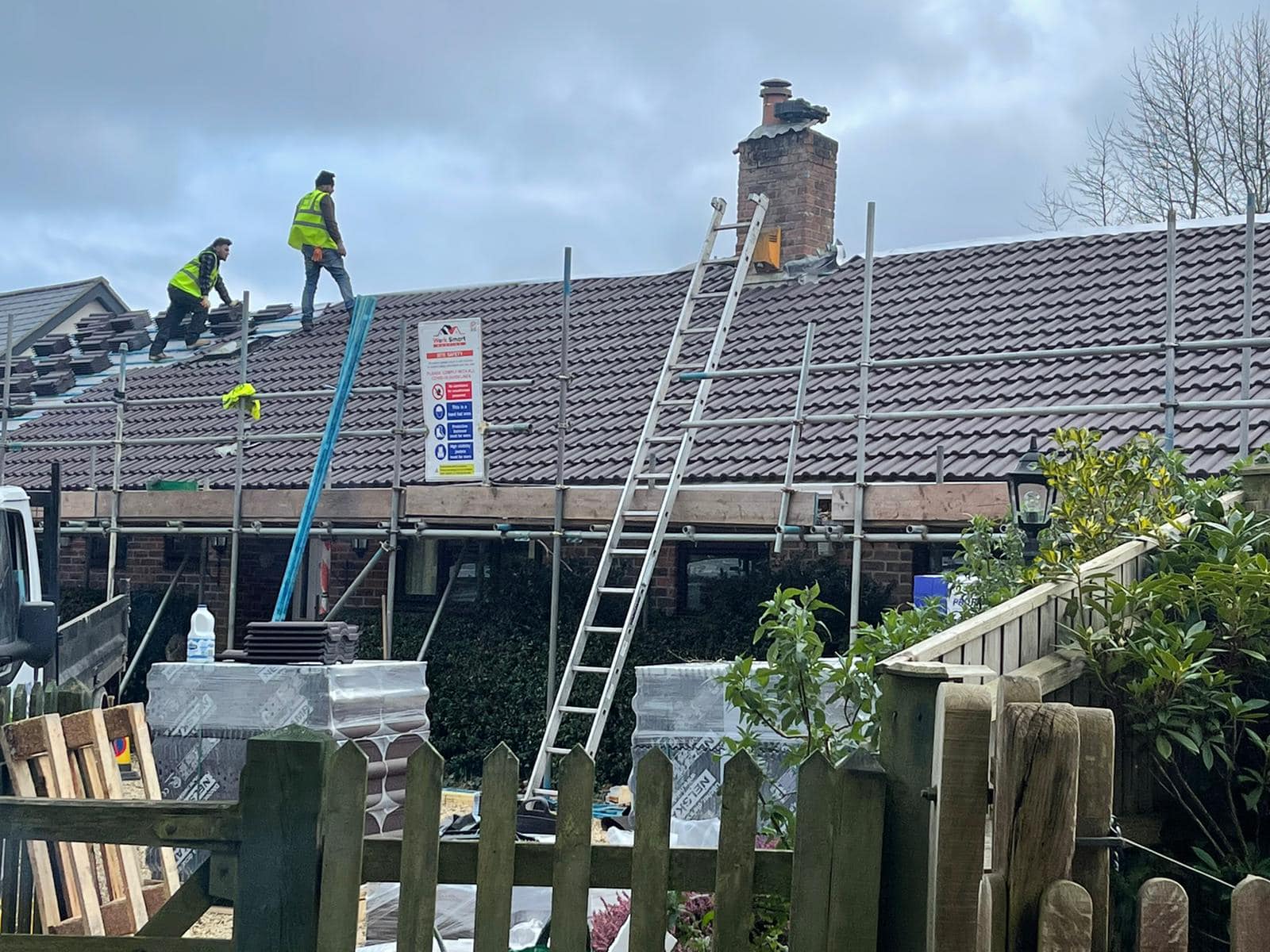 Professional roofers working on a property in London - KS Roof Master