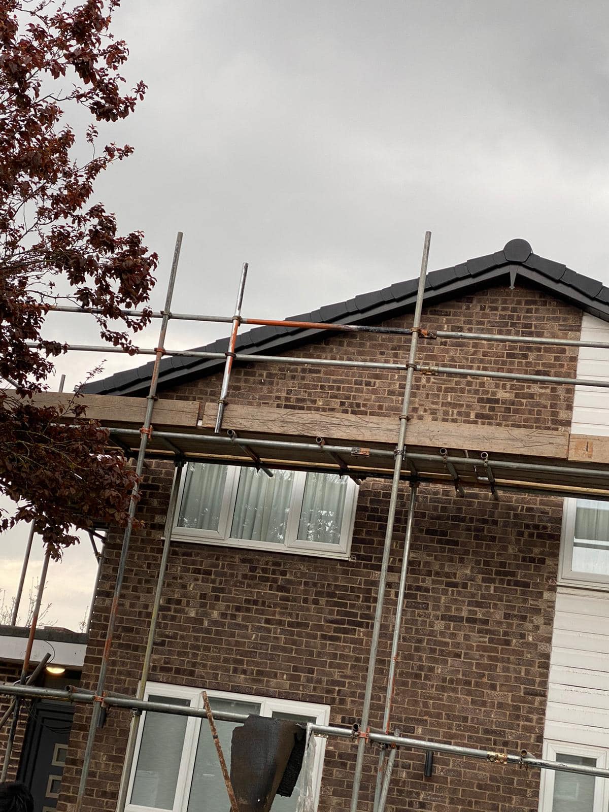 Professional roofers working on a property in London - KS Roof Master