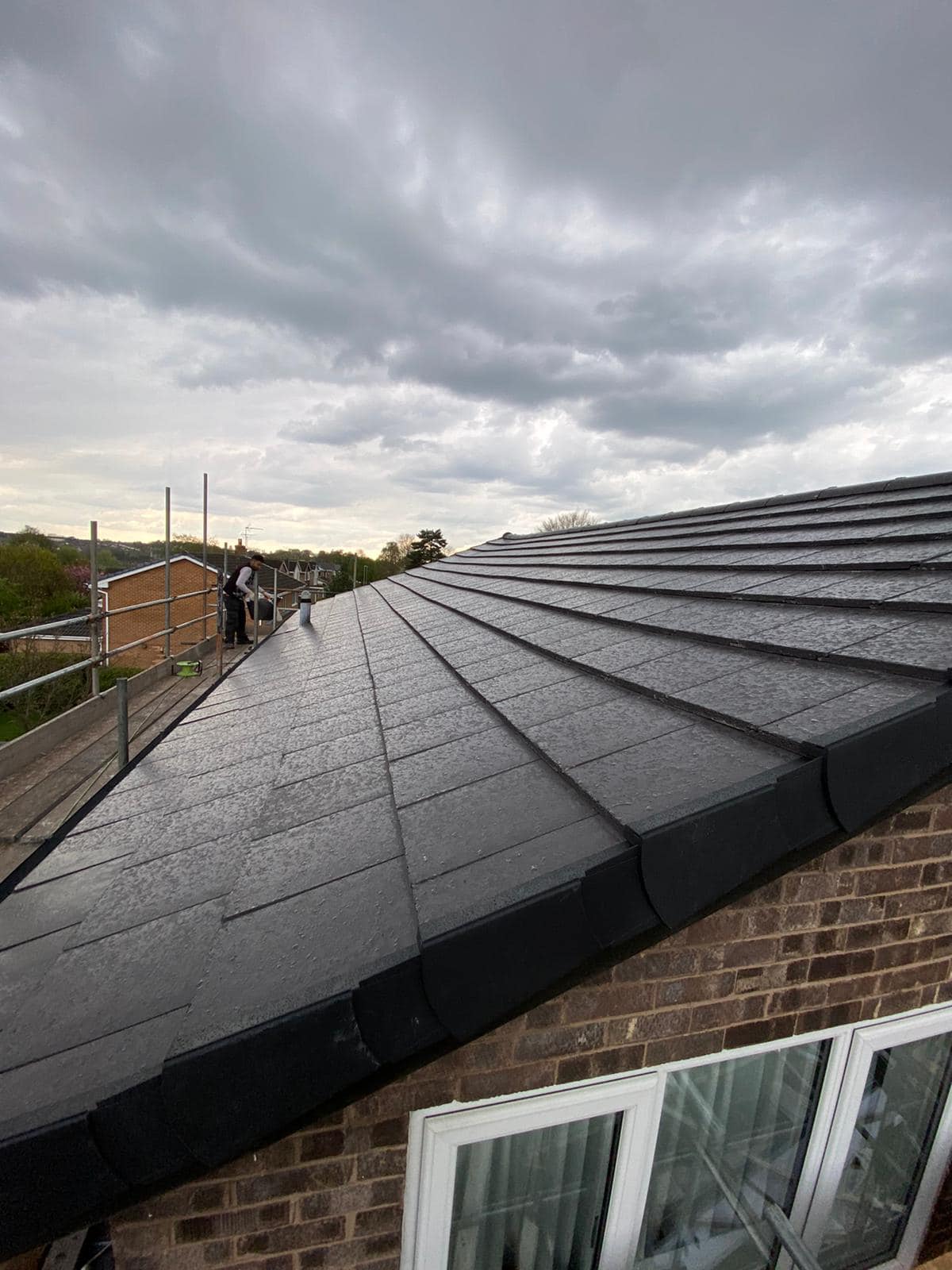 Professional roofers working on a property in London - KS Roof Master